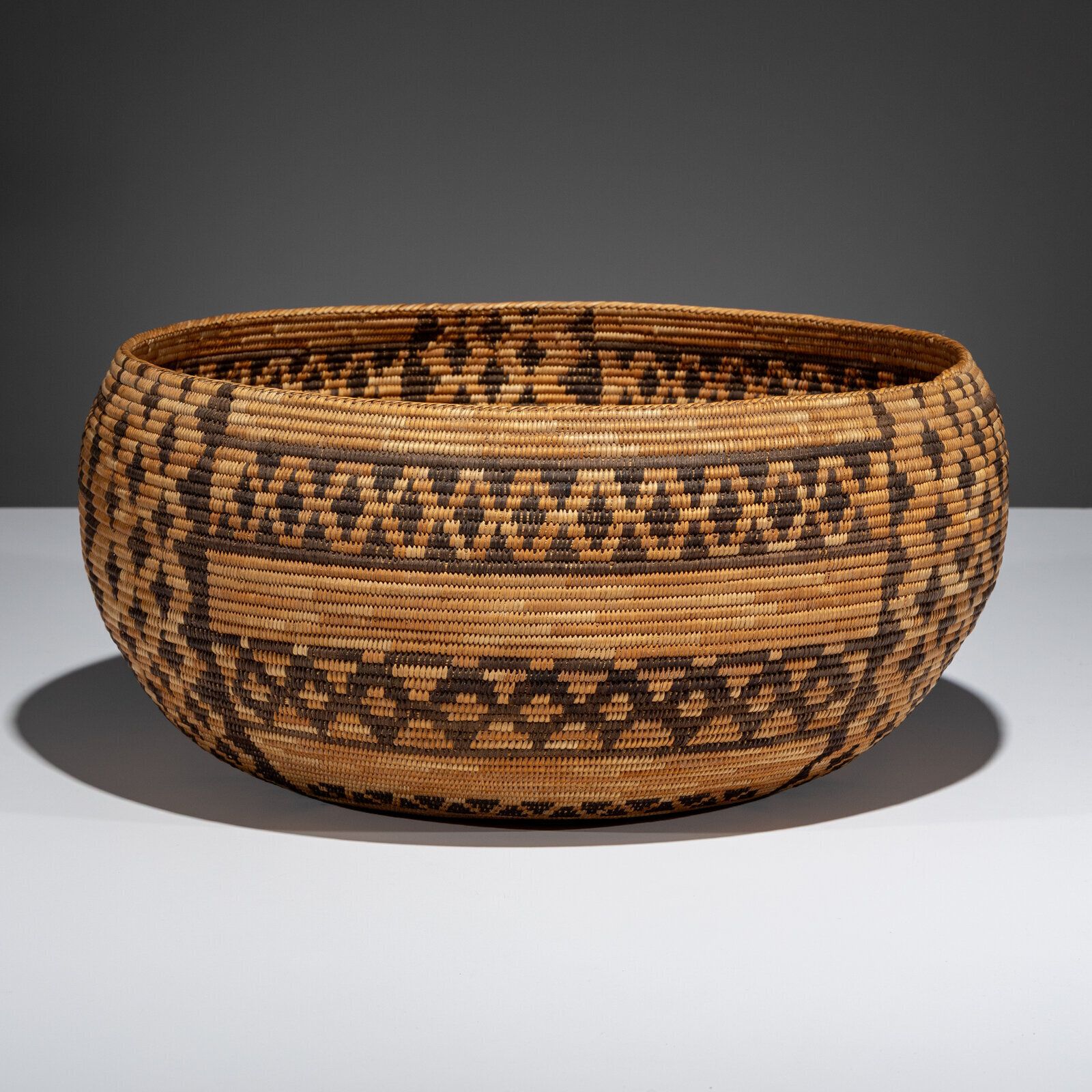 Lot 338 | Exceptional Mono Basket, with Rattlesnake Bands, early 20th century Sold for $8,320