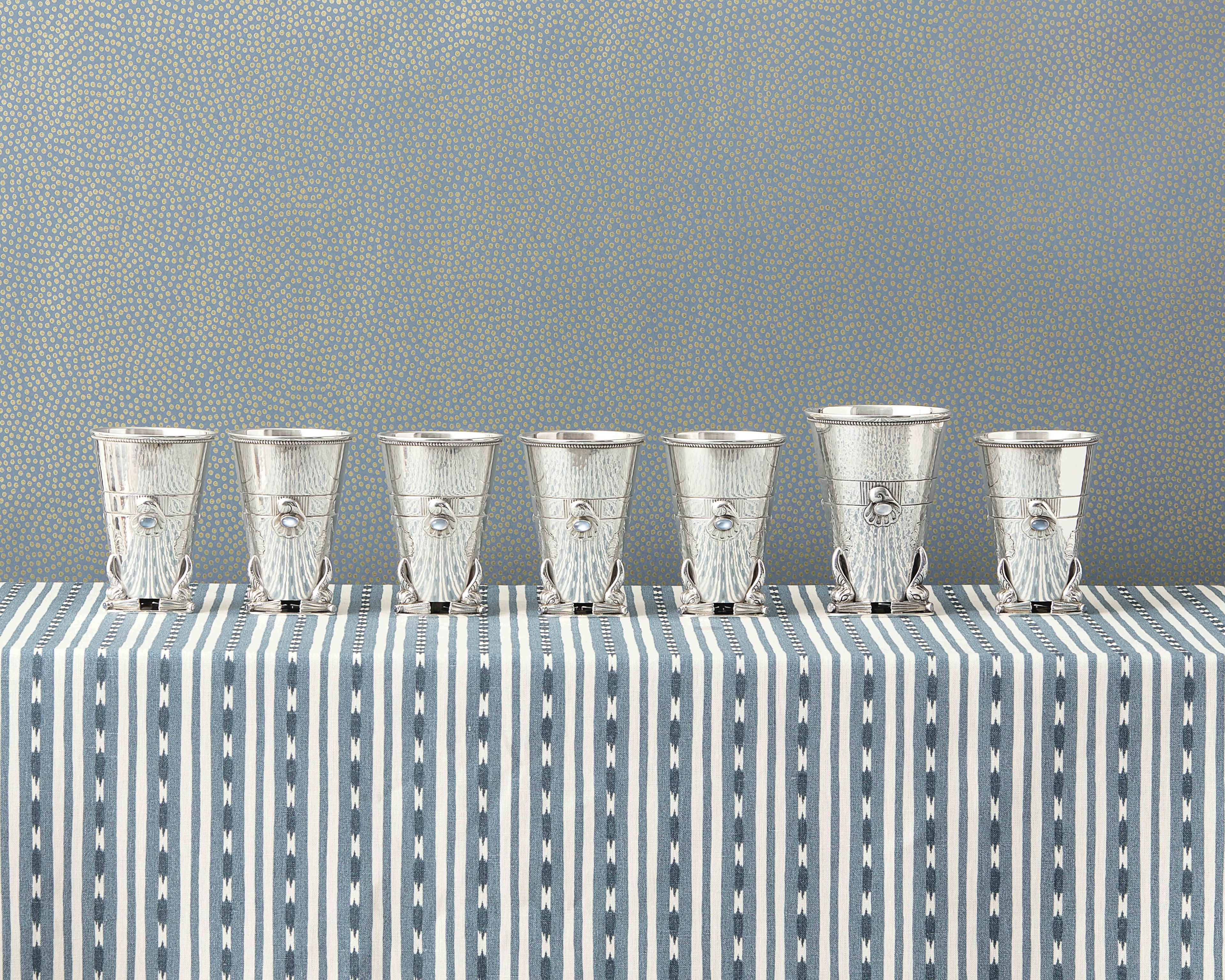 From left to right:
Lot 21 | A Set of Six Georg Jensen Silver and Moonstone Mounted Beakers | Estimate: $6,000 - 8,000
Lot 20 | A Georg Jensen Silver and Moonstone Mounted Vase | Estimate: $3,000 - 5,000