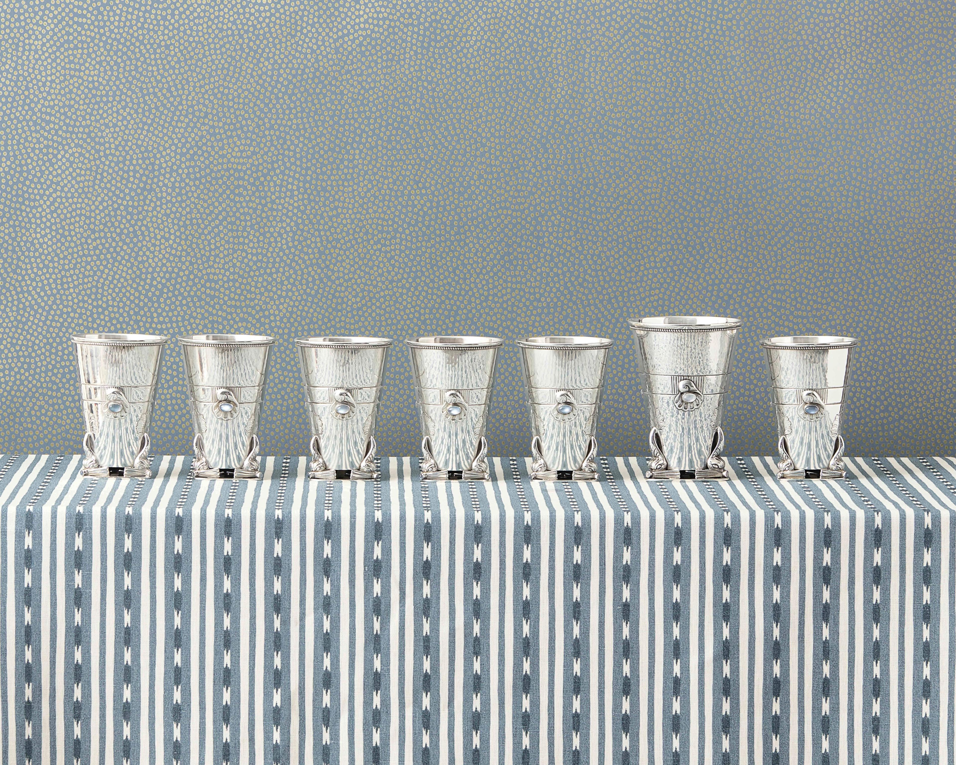 From left to right:
Lot 21 | A Set of Six Georg Jensen Silver and Moonstone Mounted Beakers | Estimate: $6,000 - 8,000
Lot 20 | A Georg Jensen Silver and Moonstone Mounted Vase | Estimate: $3,000 - 5,000