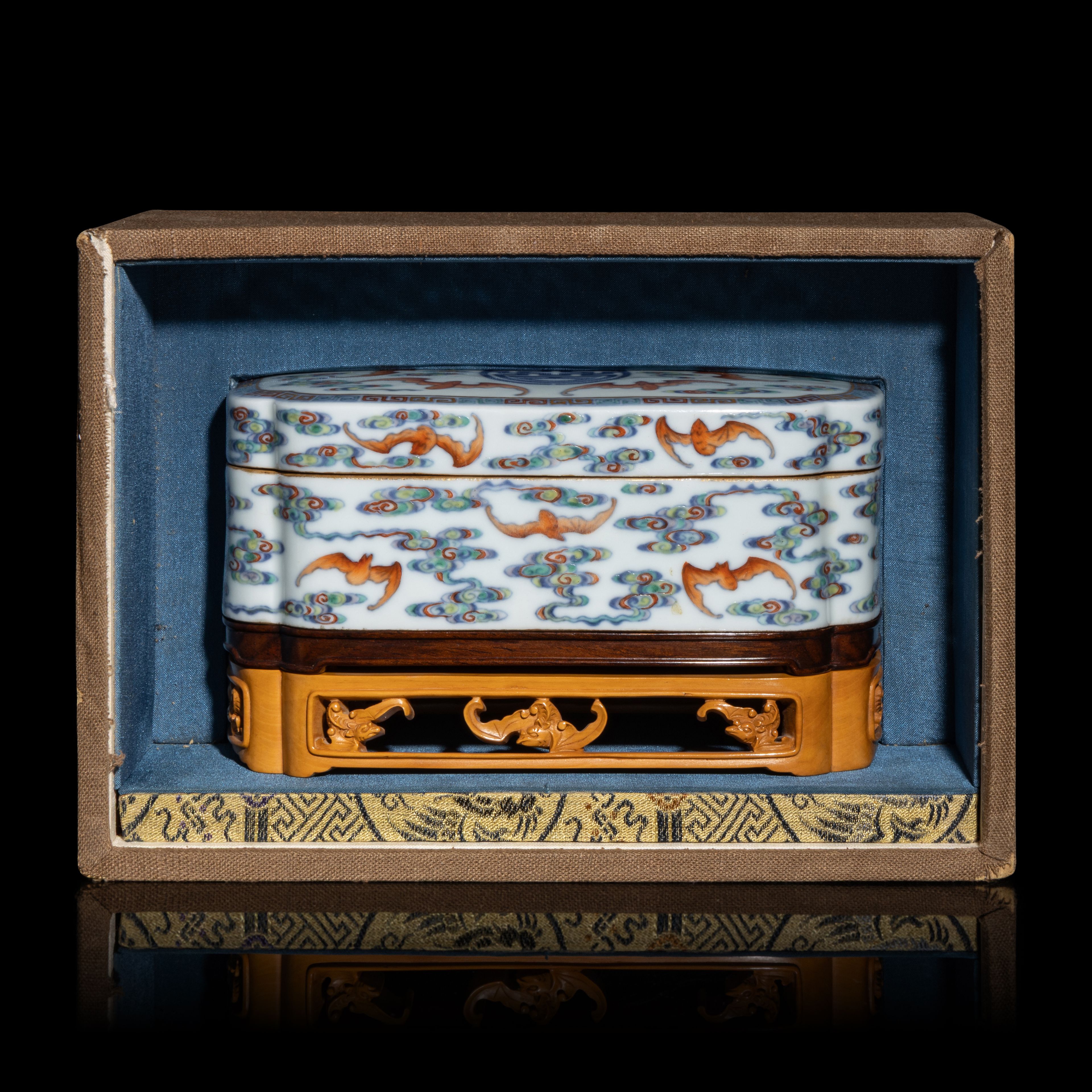 Lot 387 | A Chinese Doucai Porcelain 'Bats and Clouds' Box and Cover, 18th Century. SOLD FOR $140,800