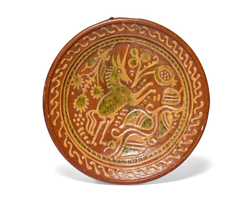 Lot 191 | A Dutch Slip-Decorated Earthenware Footed Charger, 17th Century, Estimate: $800 - $1,200