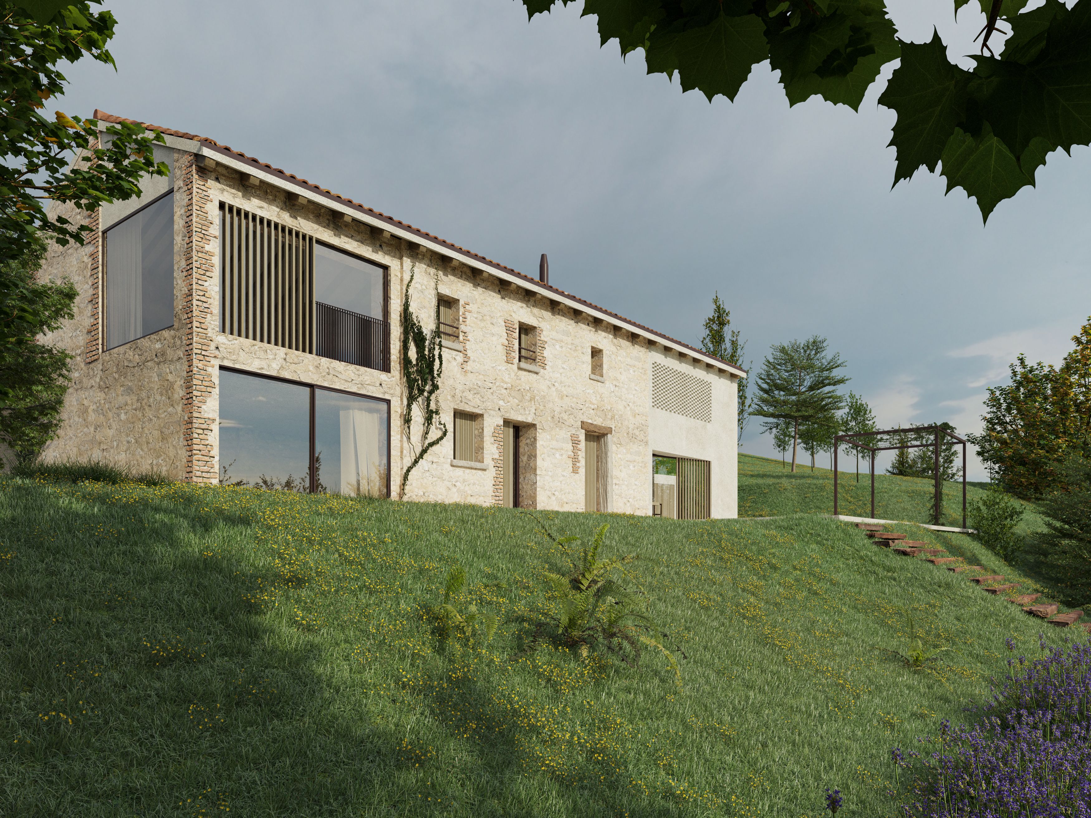 foto a colori di una residenza ristrutturata in collina