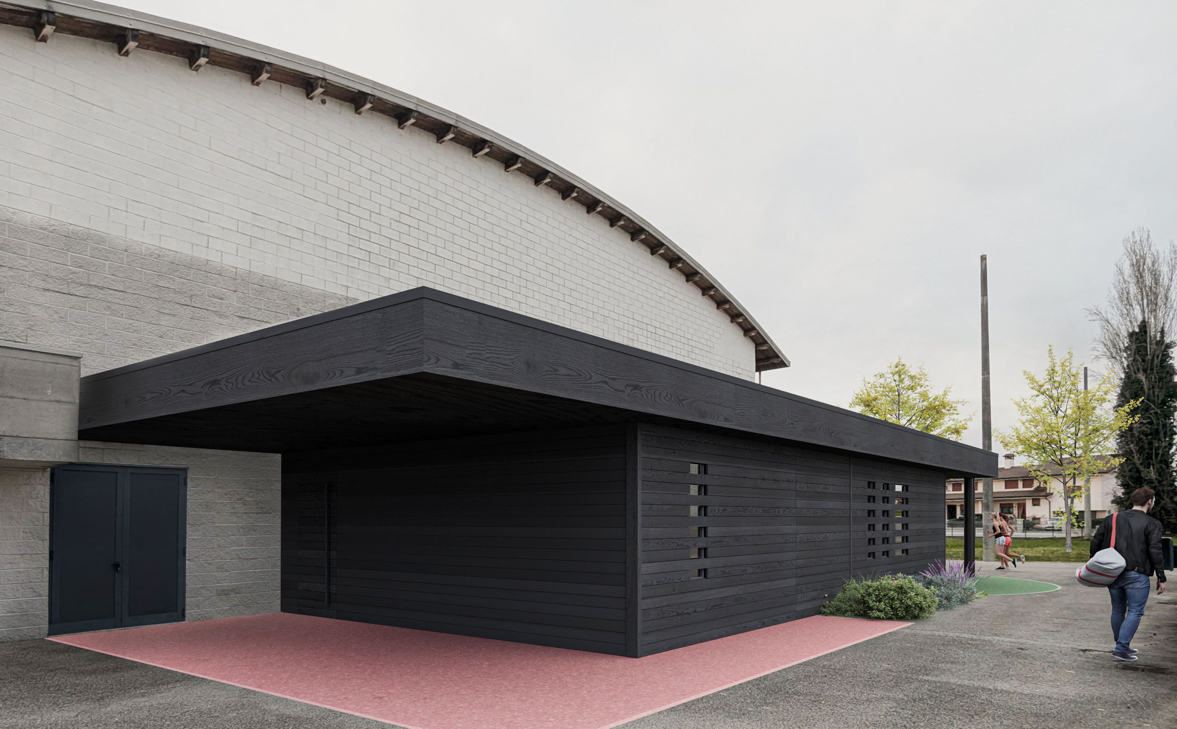 foto a colori di un edificio, palestra con ampliamento, sportivi che camminano vicino 