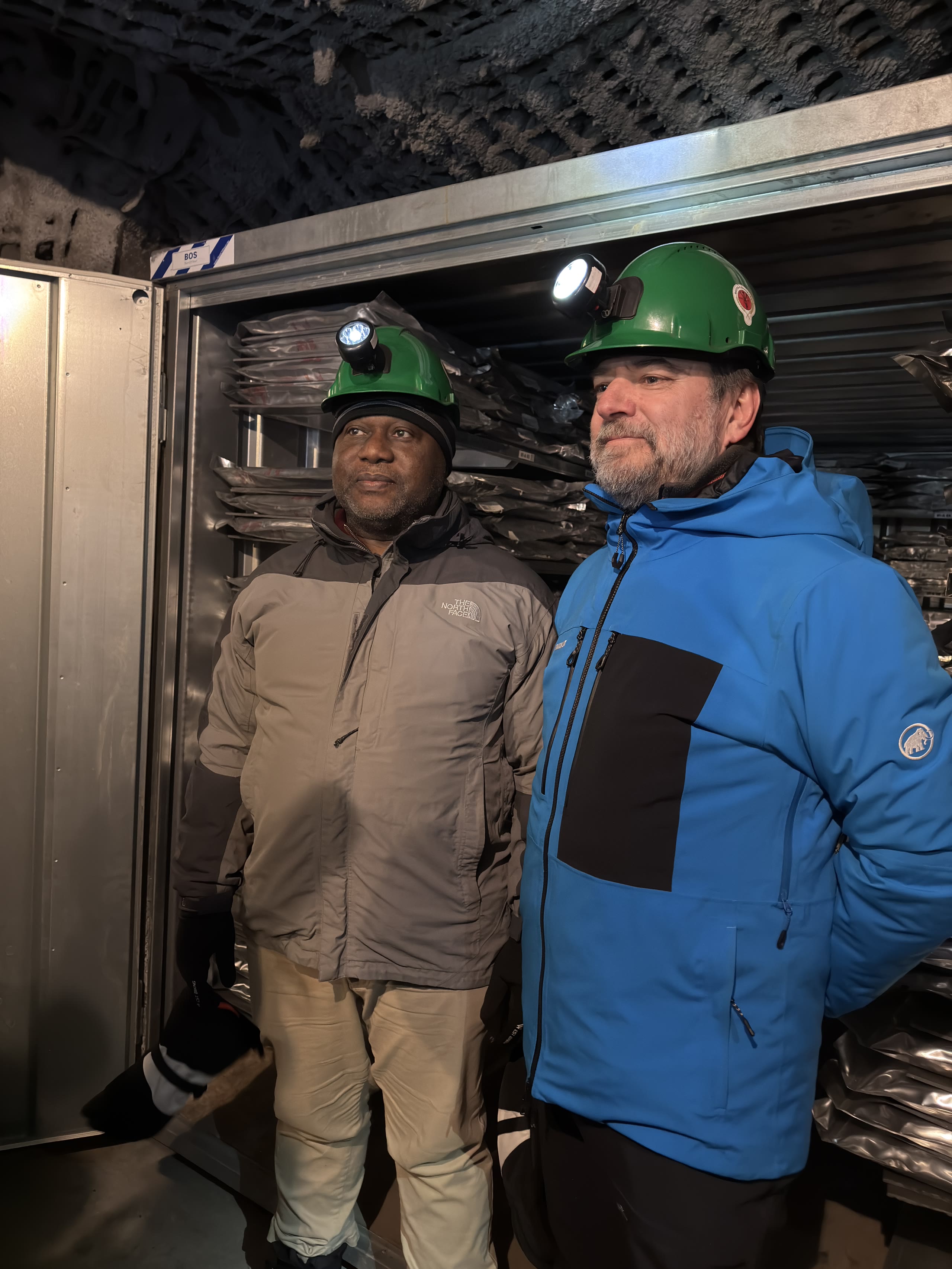 Two men standing in front of an underground data vault