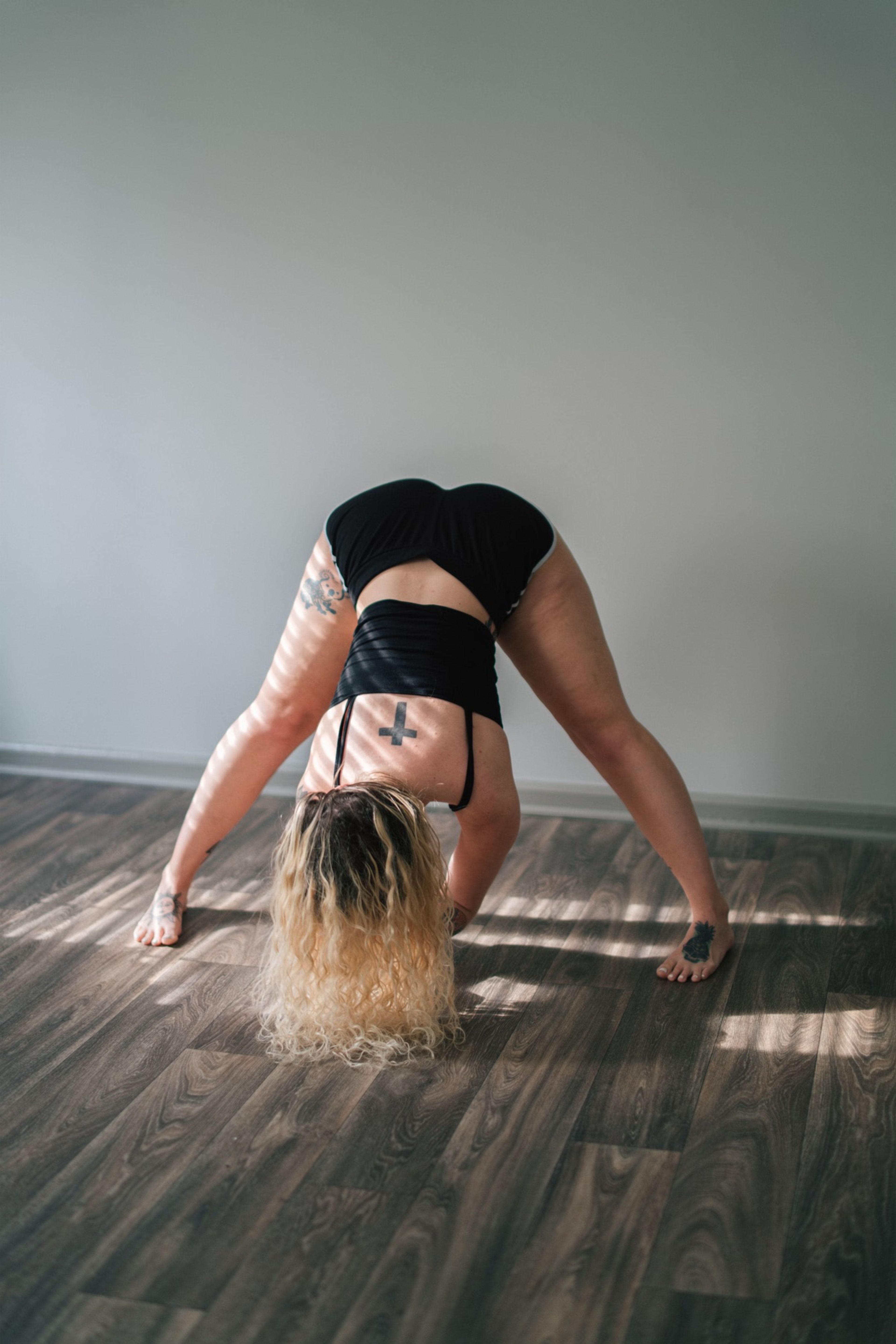 Woman folding forward in a wide-legged stretch