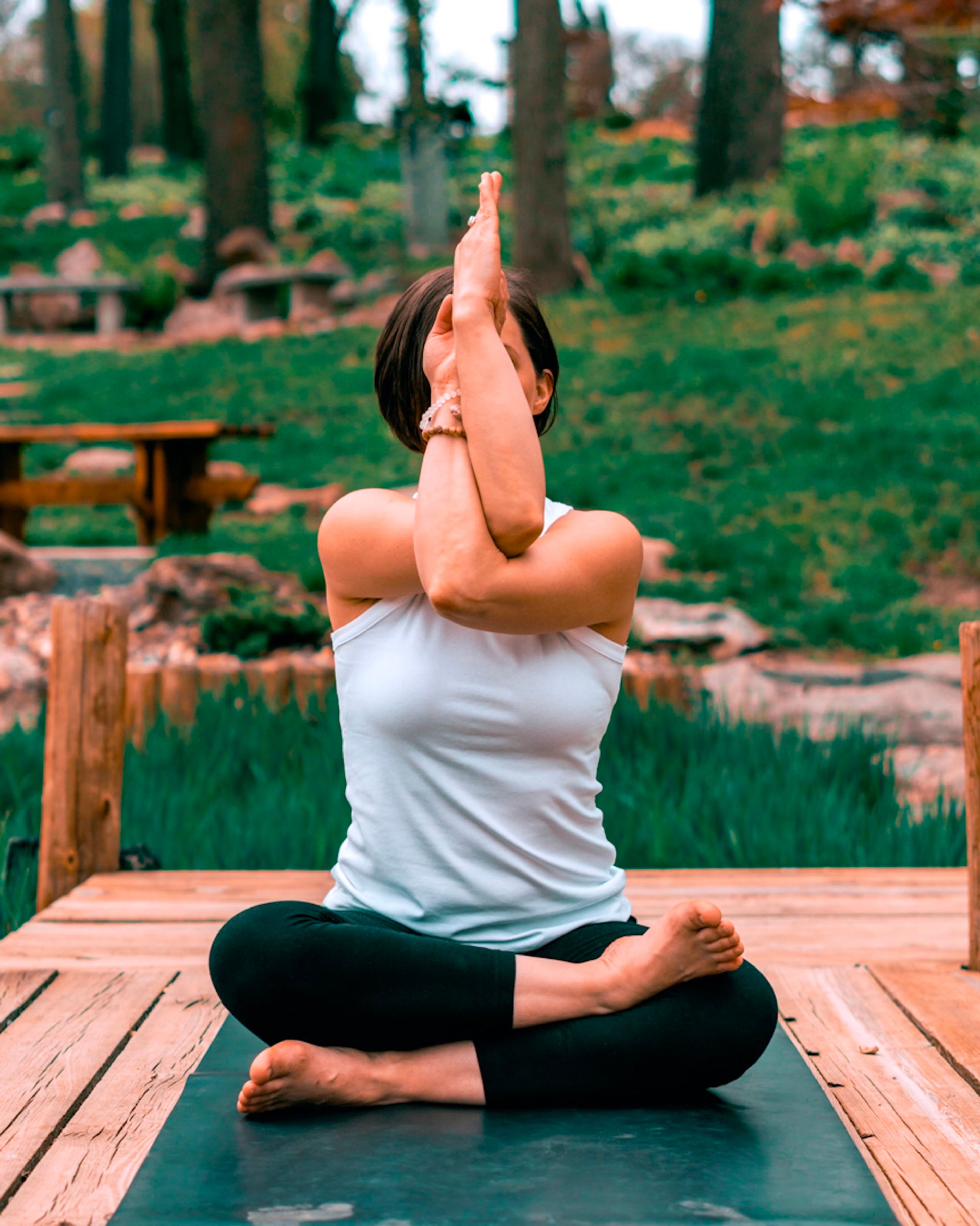 Woman stretching her arms overhead outdoors