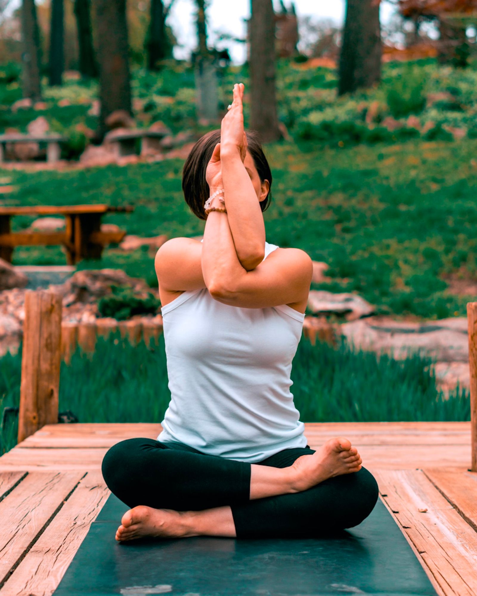 Woman stretching her arms overhead outdoors