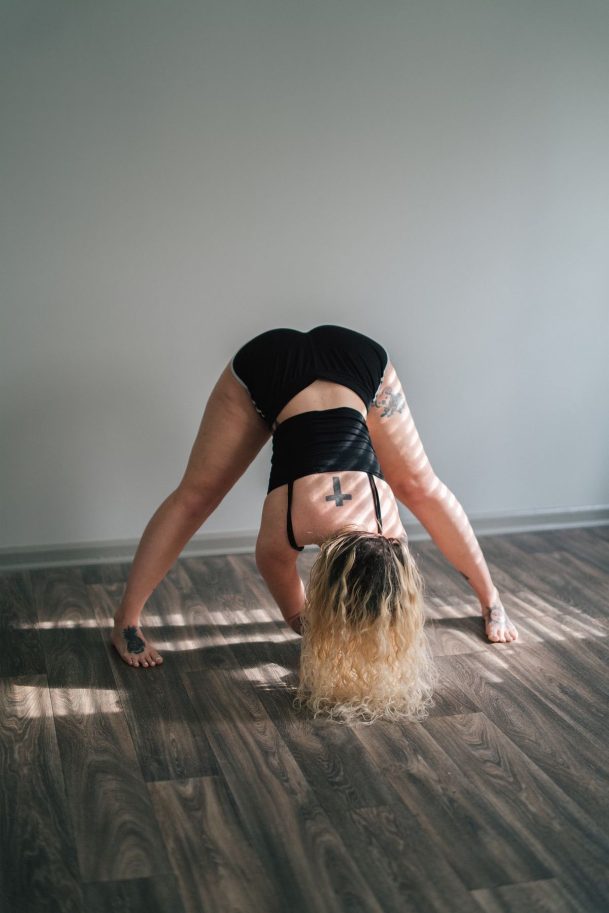 Woman in a wide-legged forward fold