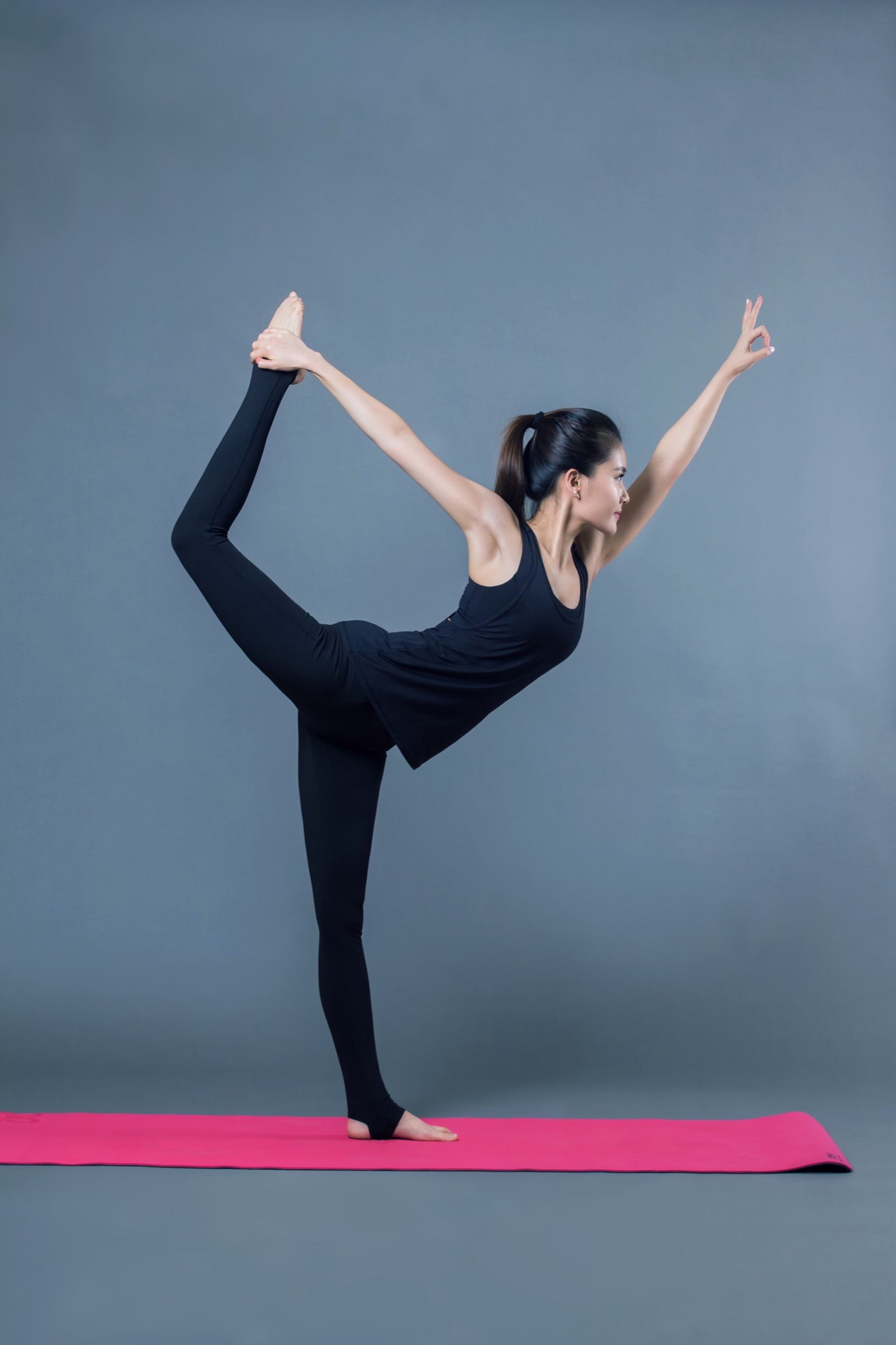 Woman balancing in dancer pose