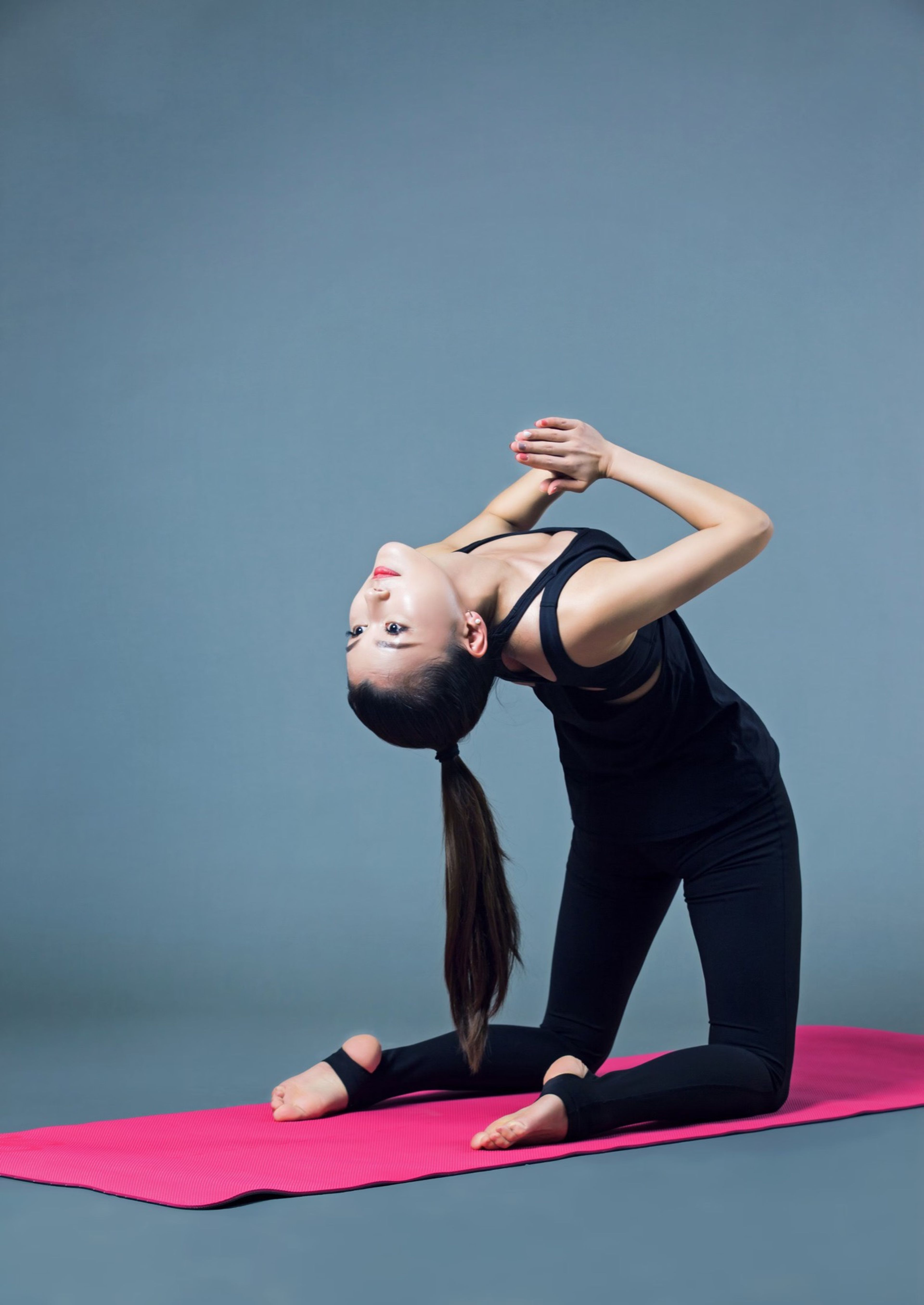 Woman stretching her arms behind her head
