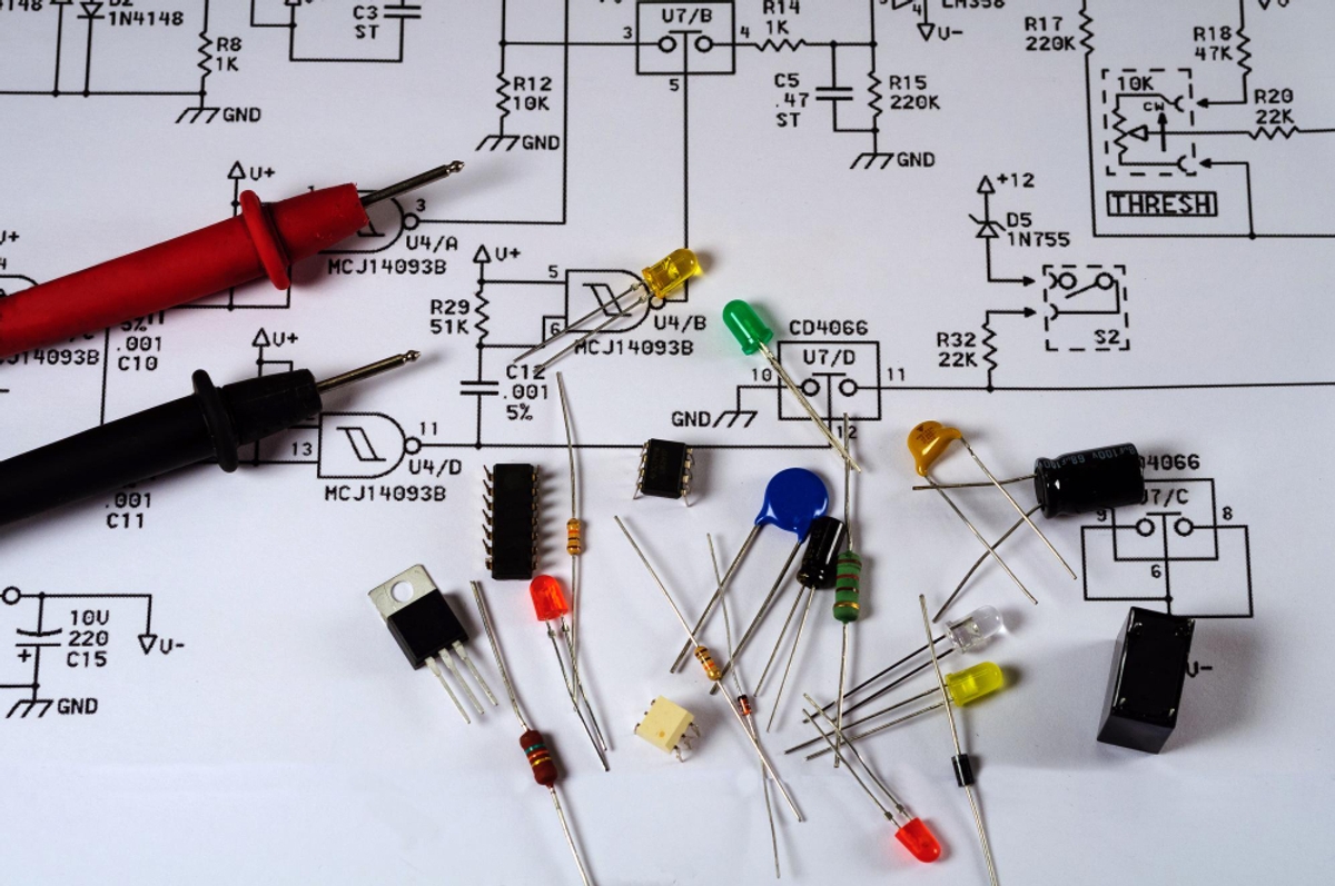 A table displaying electrical components and circuit boards for Electrical Schematic Design &amp; Drawing