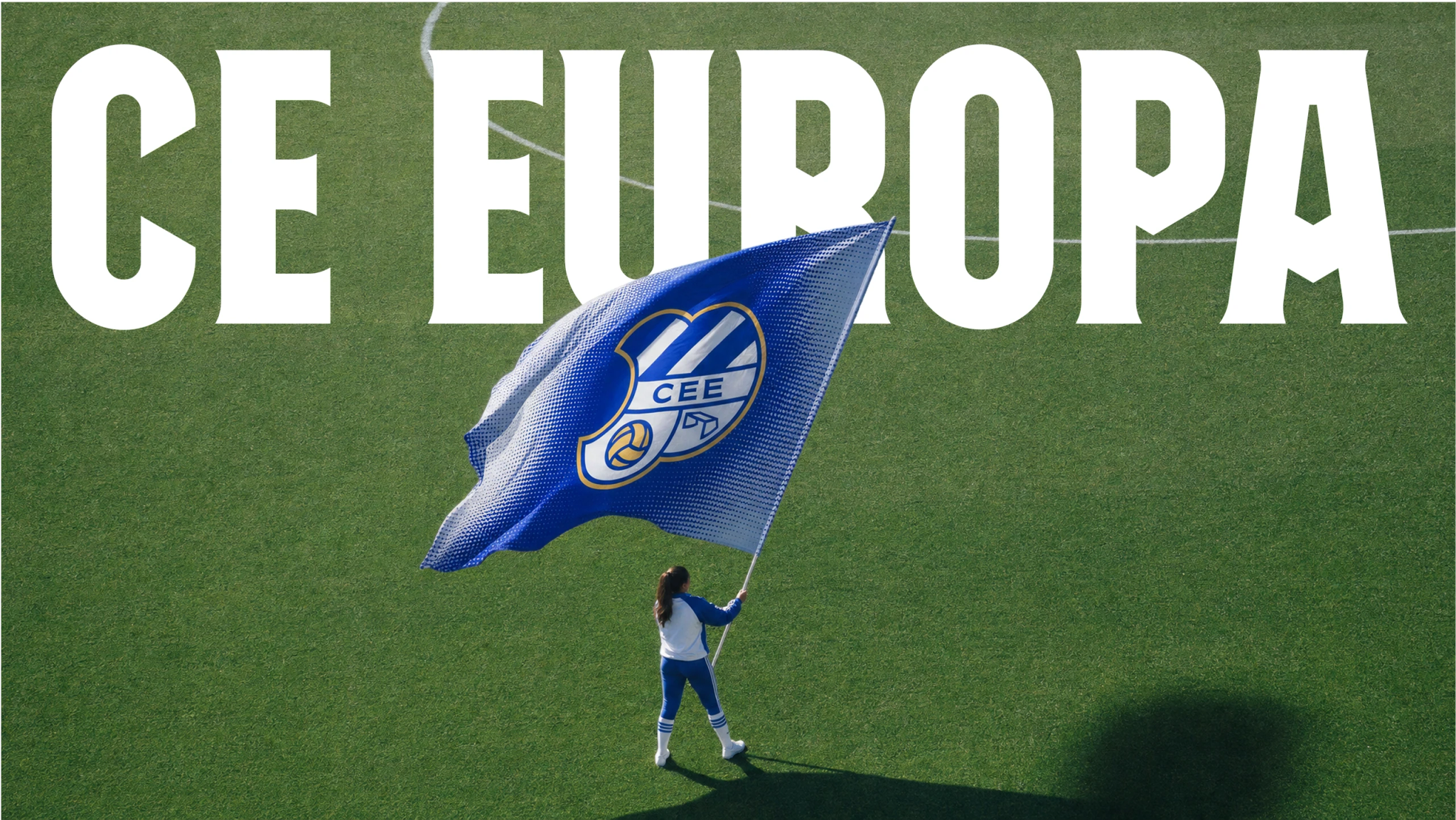 CE Europa — a supporter waving the club flag on the pitch, under the CE Europa wordmark