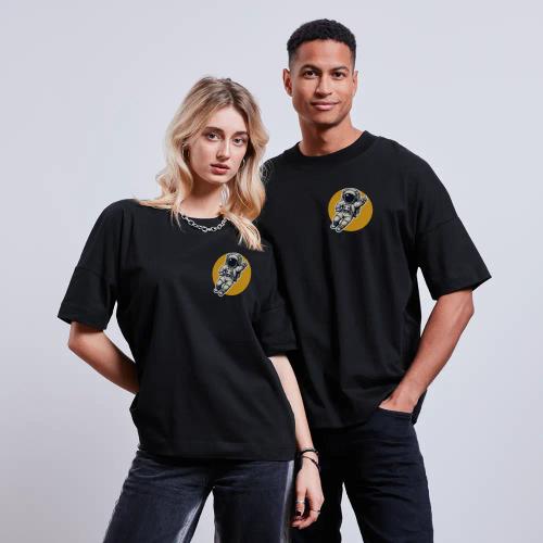 A women and a men wearing black T-shirts with a gravity-shirts design.