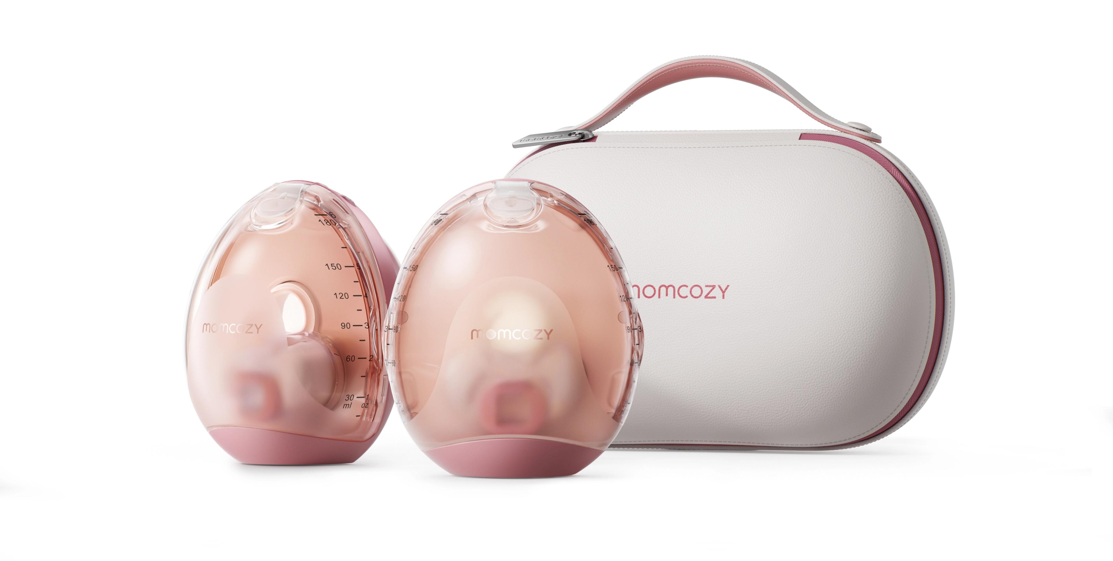 Two pink and clear Momcozy wearable breast pumps next to a white carrying case.