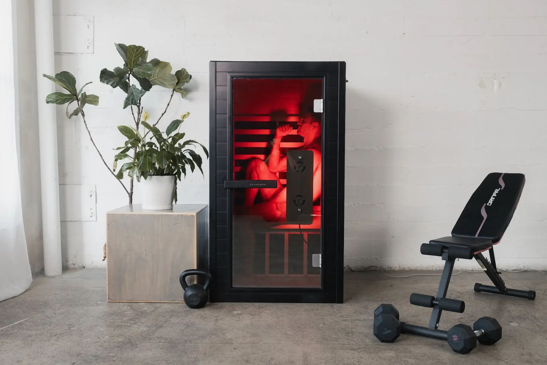 Man using SaunaBox in home gym