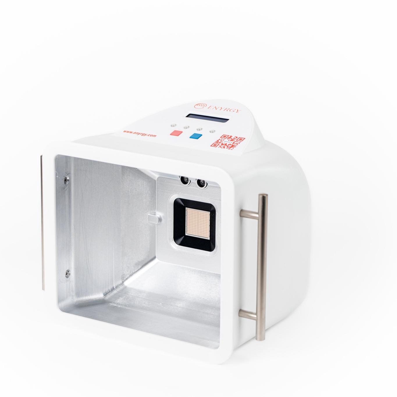 A white scientific device with an open, reflective interior containing a sensor, featuring a screen and buttons on top and a handle on the side.
