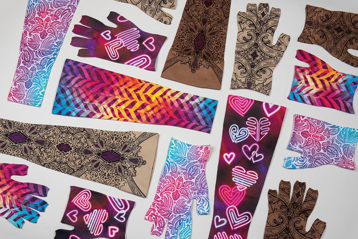 Assortment of patterned fingerless gloves and arm sleeves, featuring designs like colorful paisleys, geometric stripes, and neon hearts.