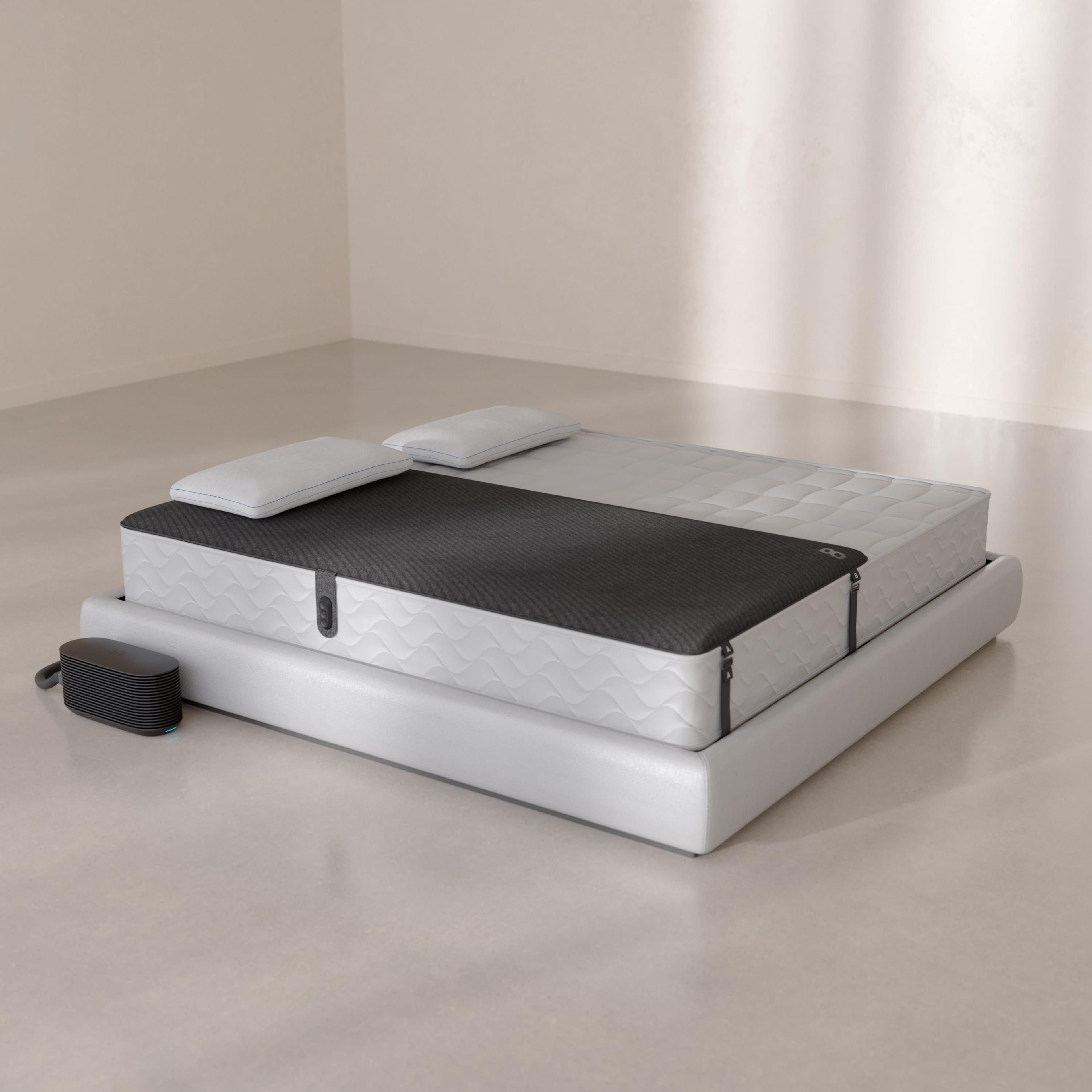 Pod 6 Solo Cover fitted over one side of a mattress with the Hub beside it