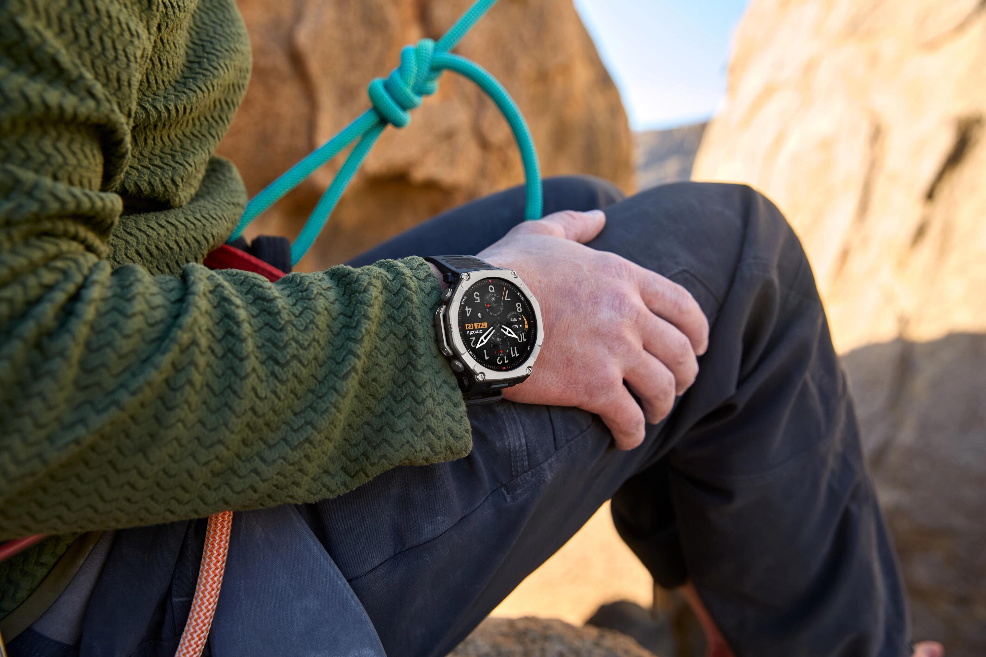 A person's wrist wearing amazfit smartwatch with a climbing rope visible.