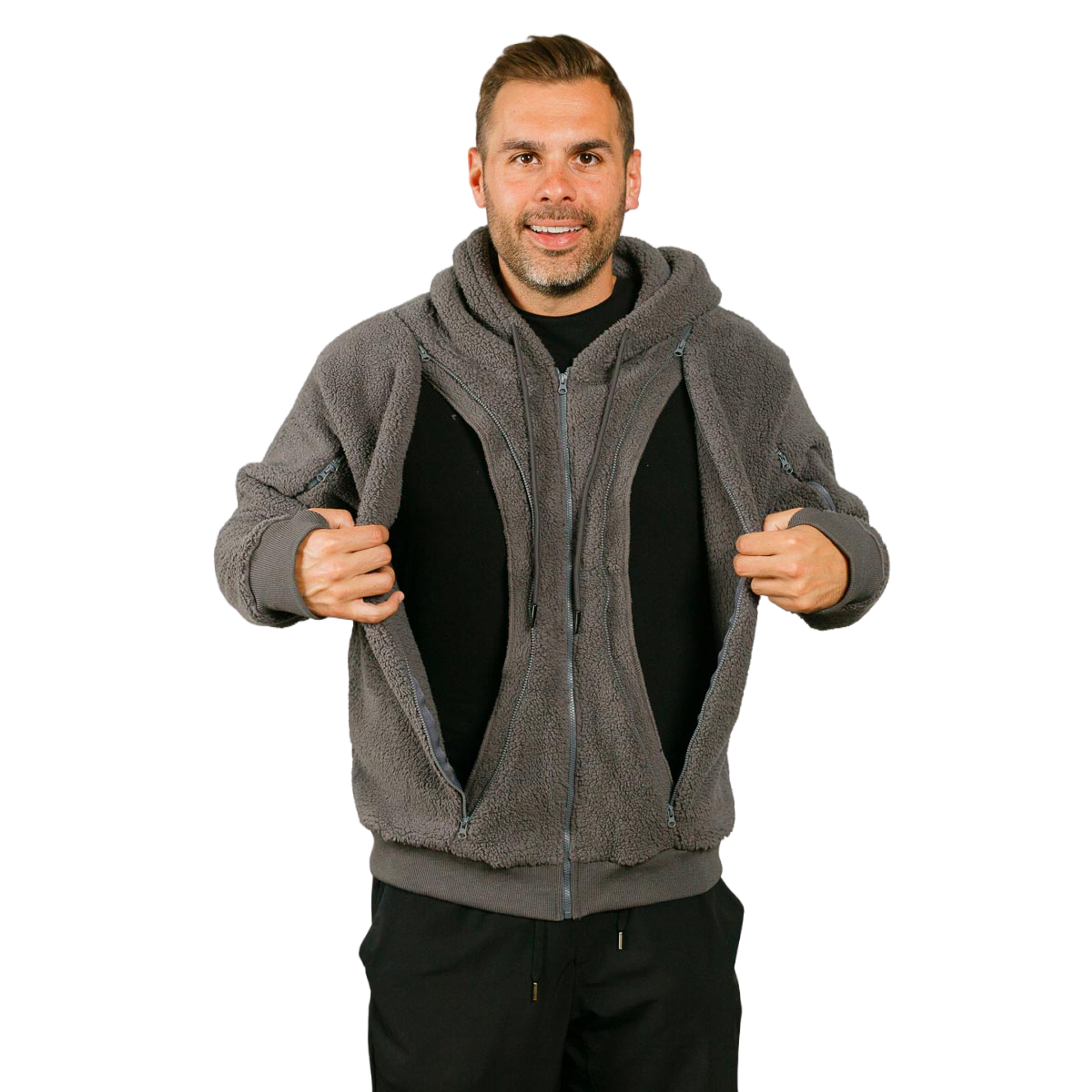 A smiling man in a grey fleece hoodie holds it open to reveal large internal pockets.