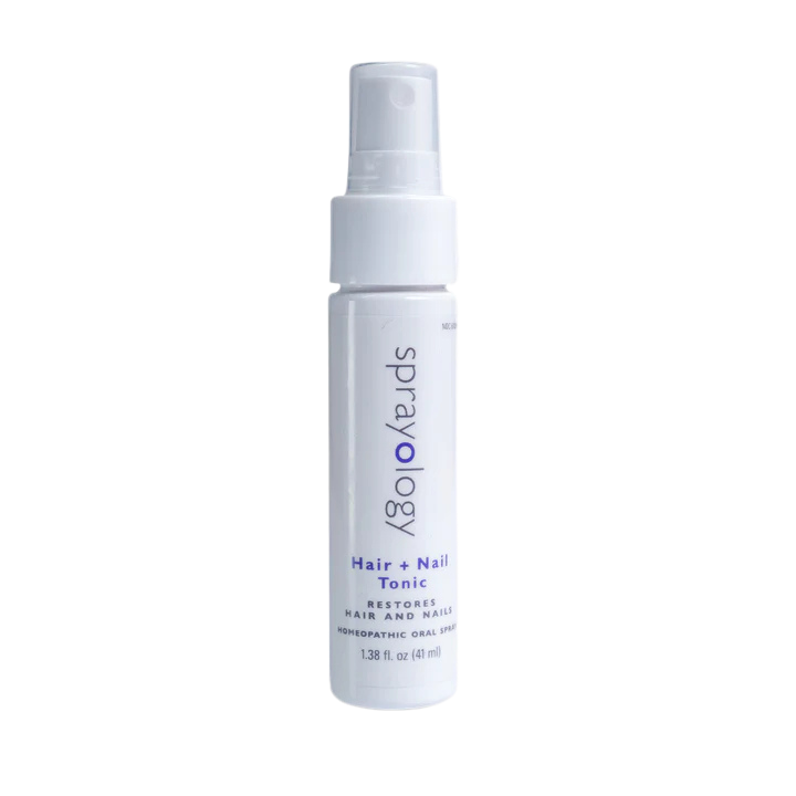A white spray bottle of Sprayology Hair + Nail Tonic.