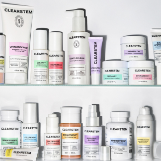 An assortment of CLEARSTEM skincare products with white packaging and colorful labels displayed on two shelves.