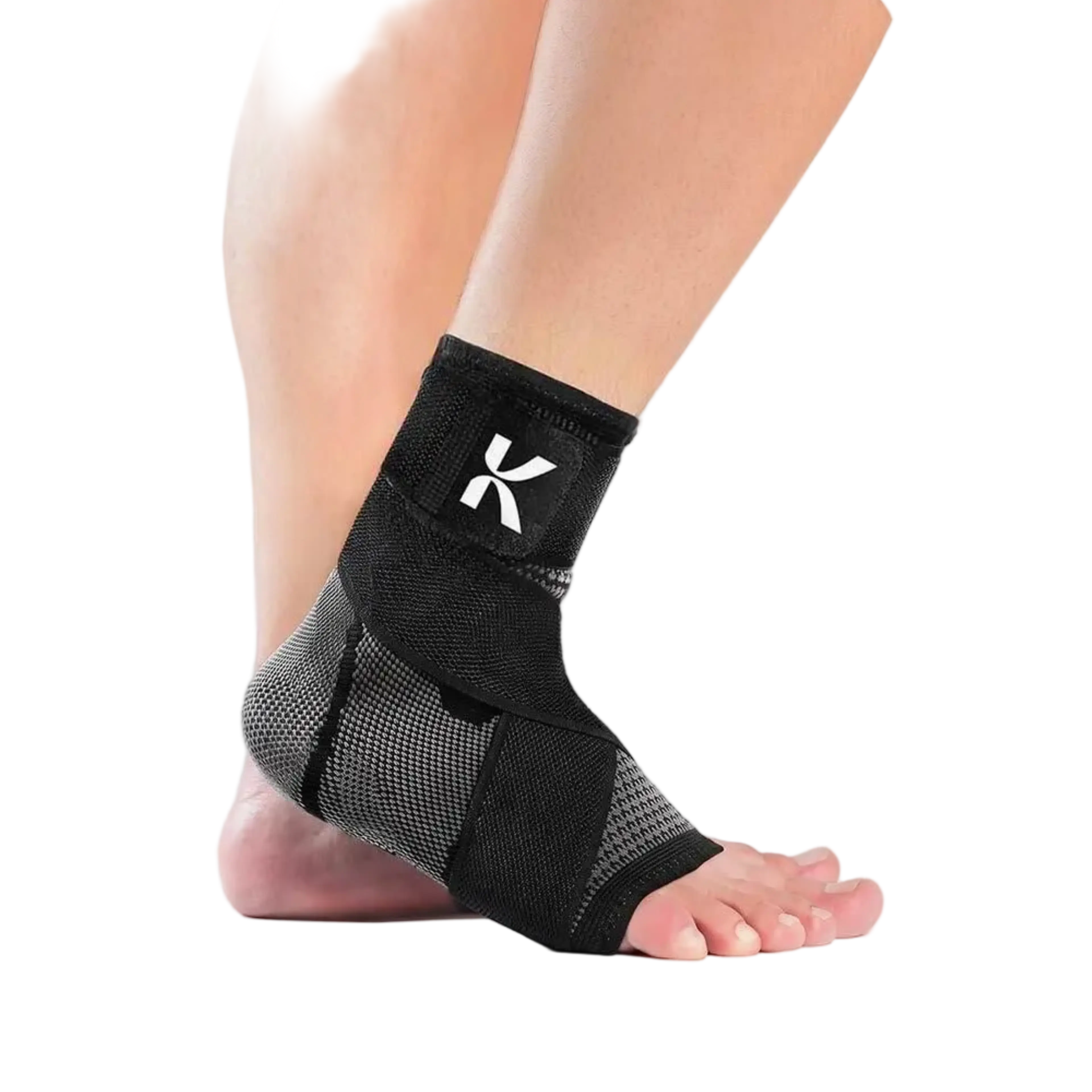 A person's foot and lower leg wearing a black and grey ankle support brace with a white K logo.