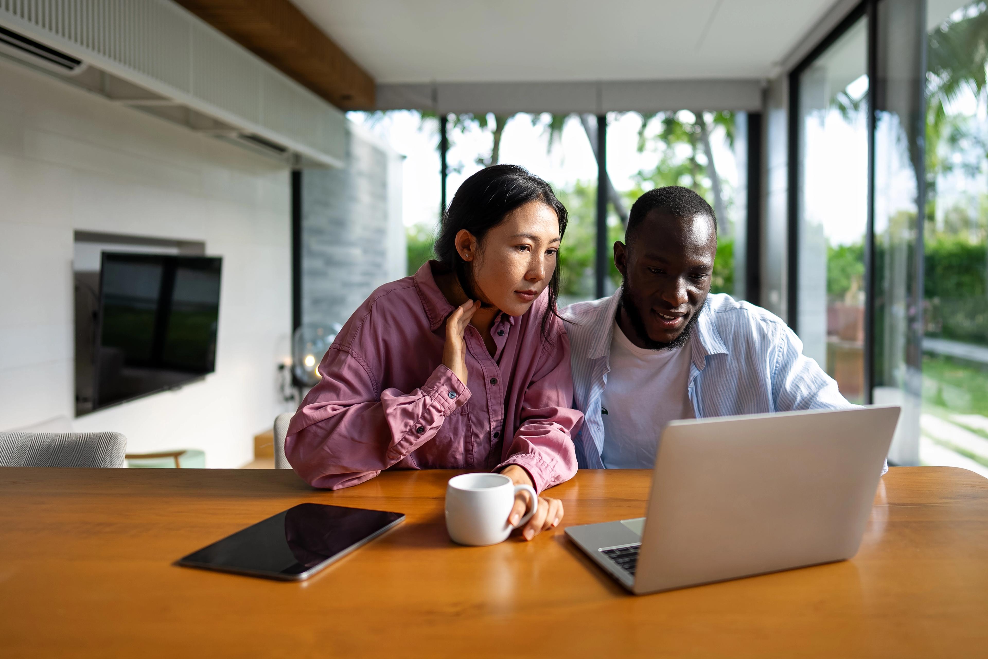 Couple sitting together at home