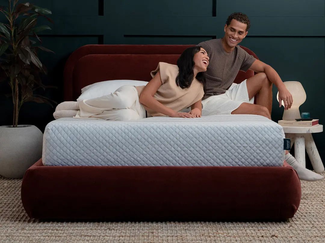Couple laying on Leesa mattress