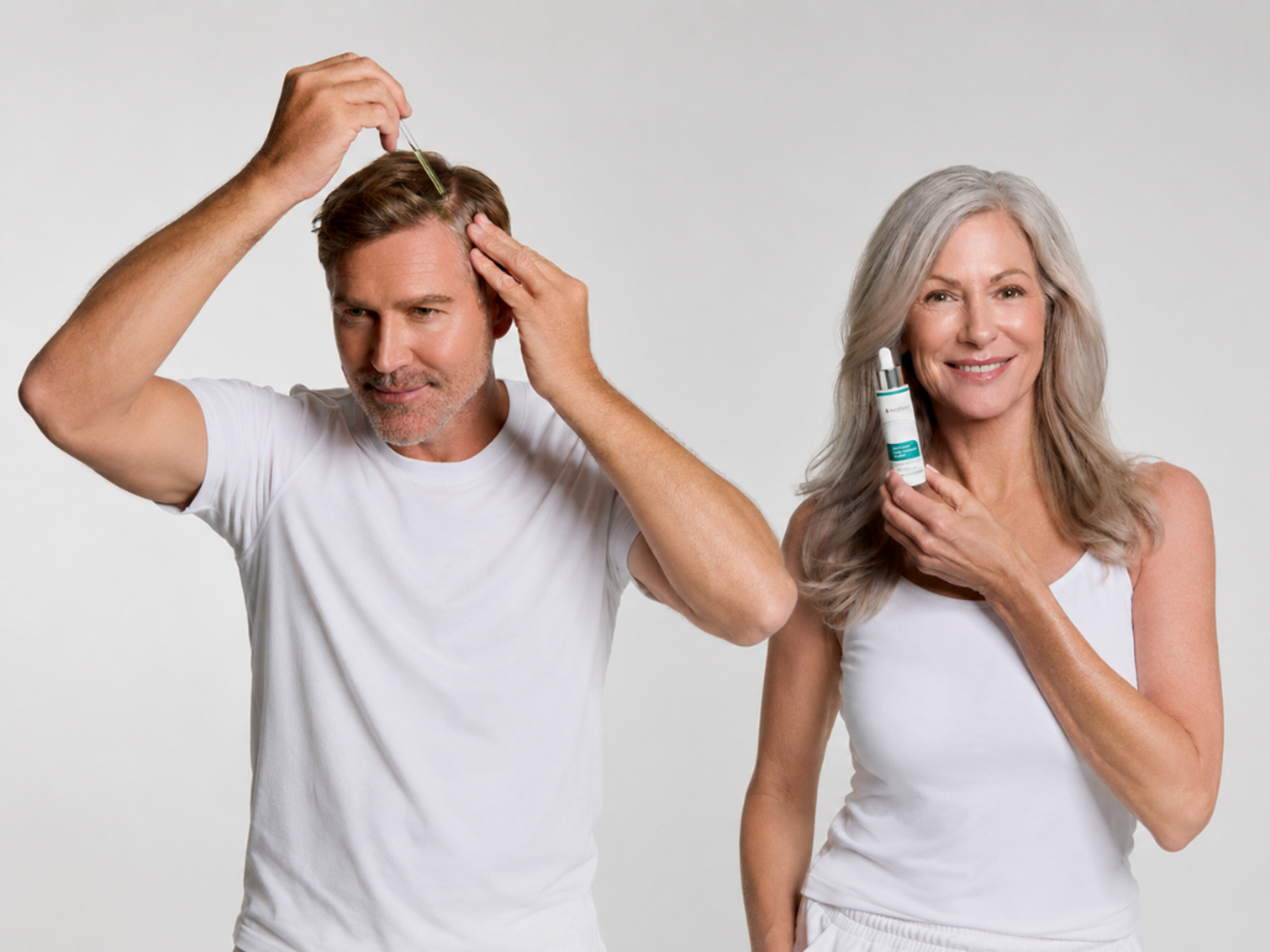 Man applying hair serum to his scalp with a dropper, woman holding the product and smiling.