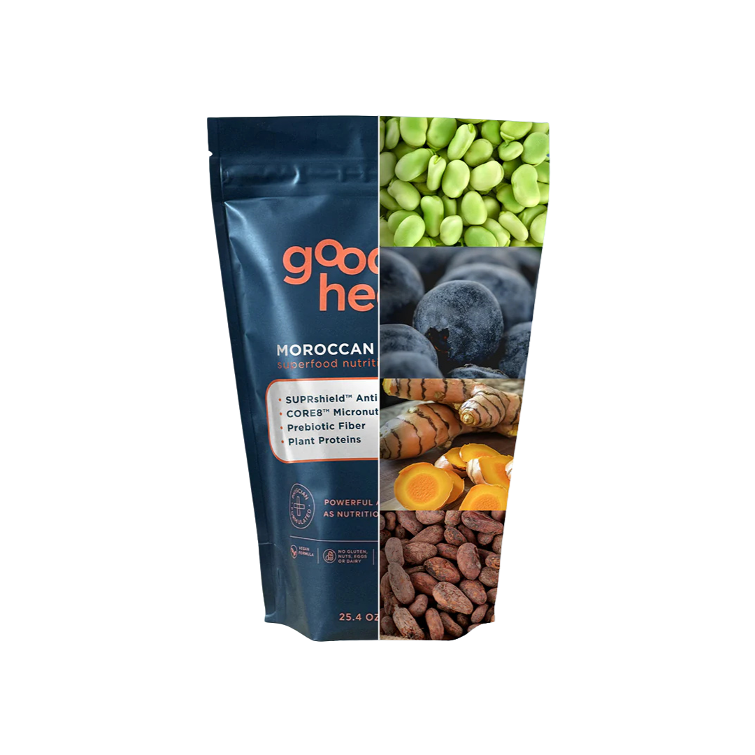 A dark blue Good Health Moroccan Superfood Nutrition pouch next to a collage of fava beans, blueberries, turmeric, and cacao beans.