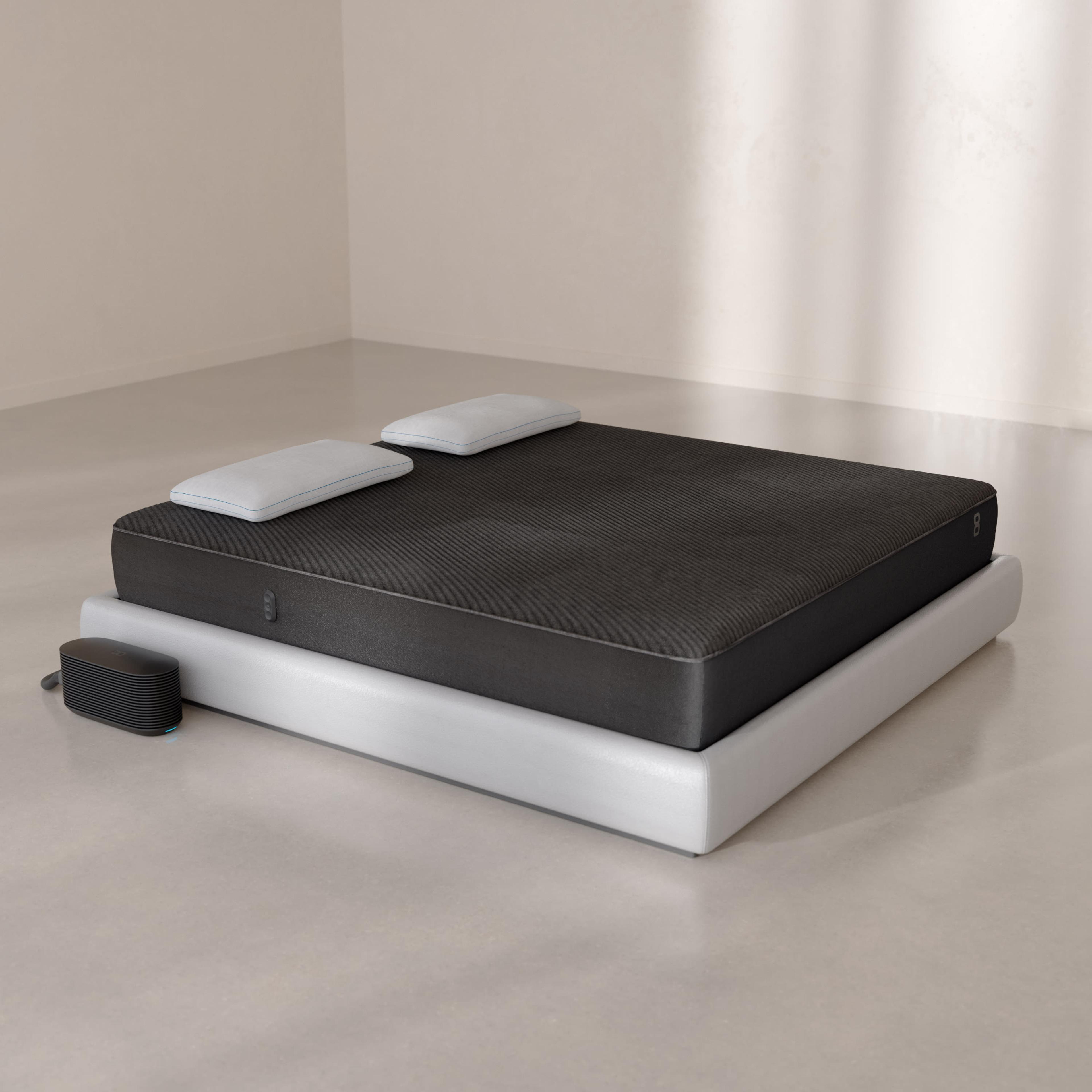 Pod 6 Cover fitted over a mattress with the Hub on the floor beside it