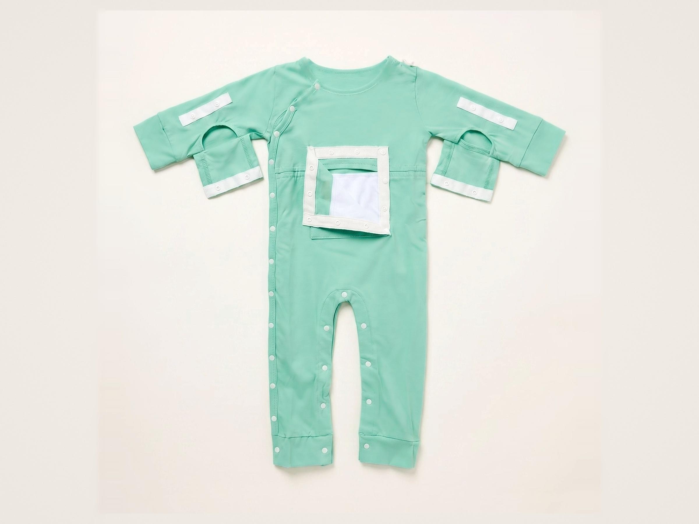 Mint green baby one-piece with full-length snaps, a rectangular chest opening, and open sleeves with white velcro tabs.