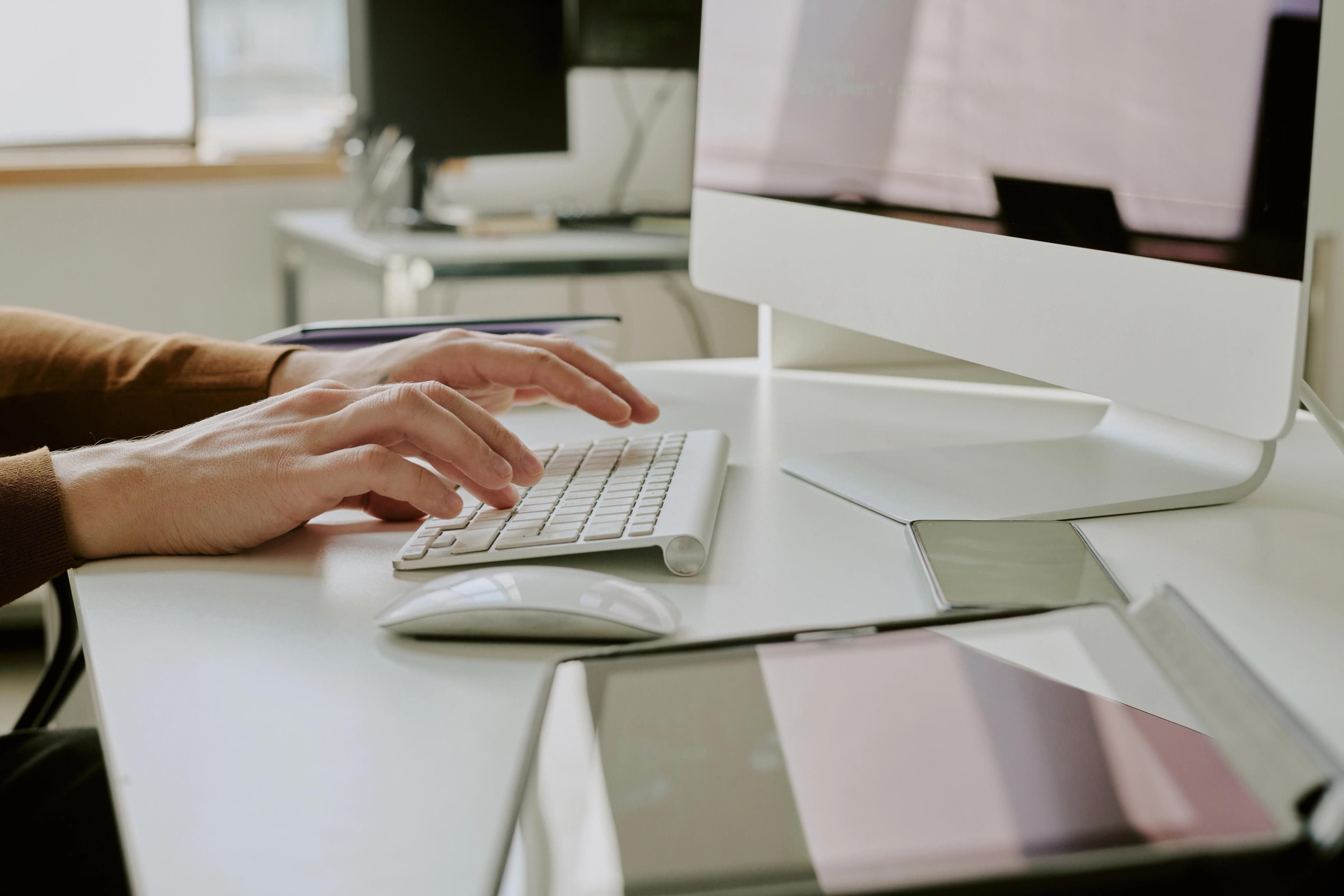 Man typing on a computer