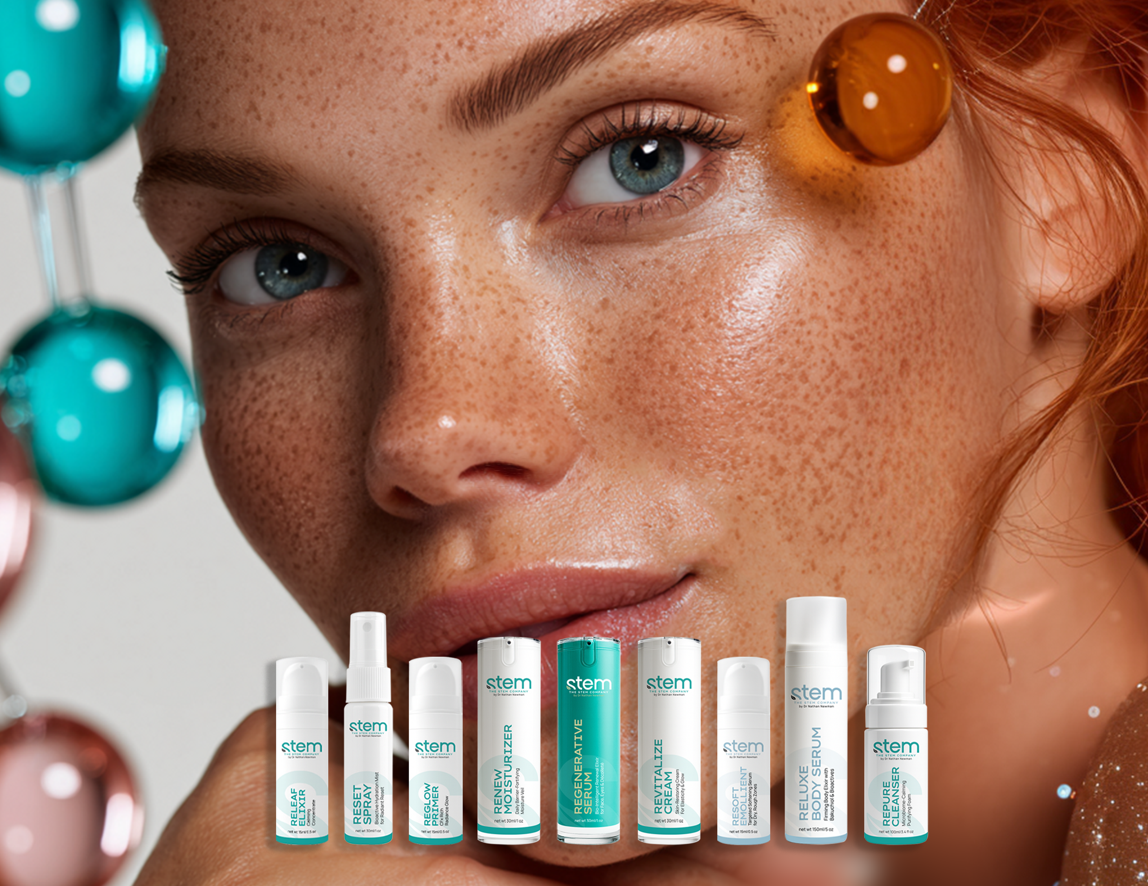 Close-up of a person with red hair, freckles, blue eyes, and glowing skin, looking up, with Stem skincare products below and blurred ornaments in the background.