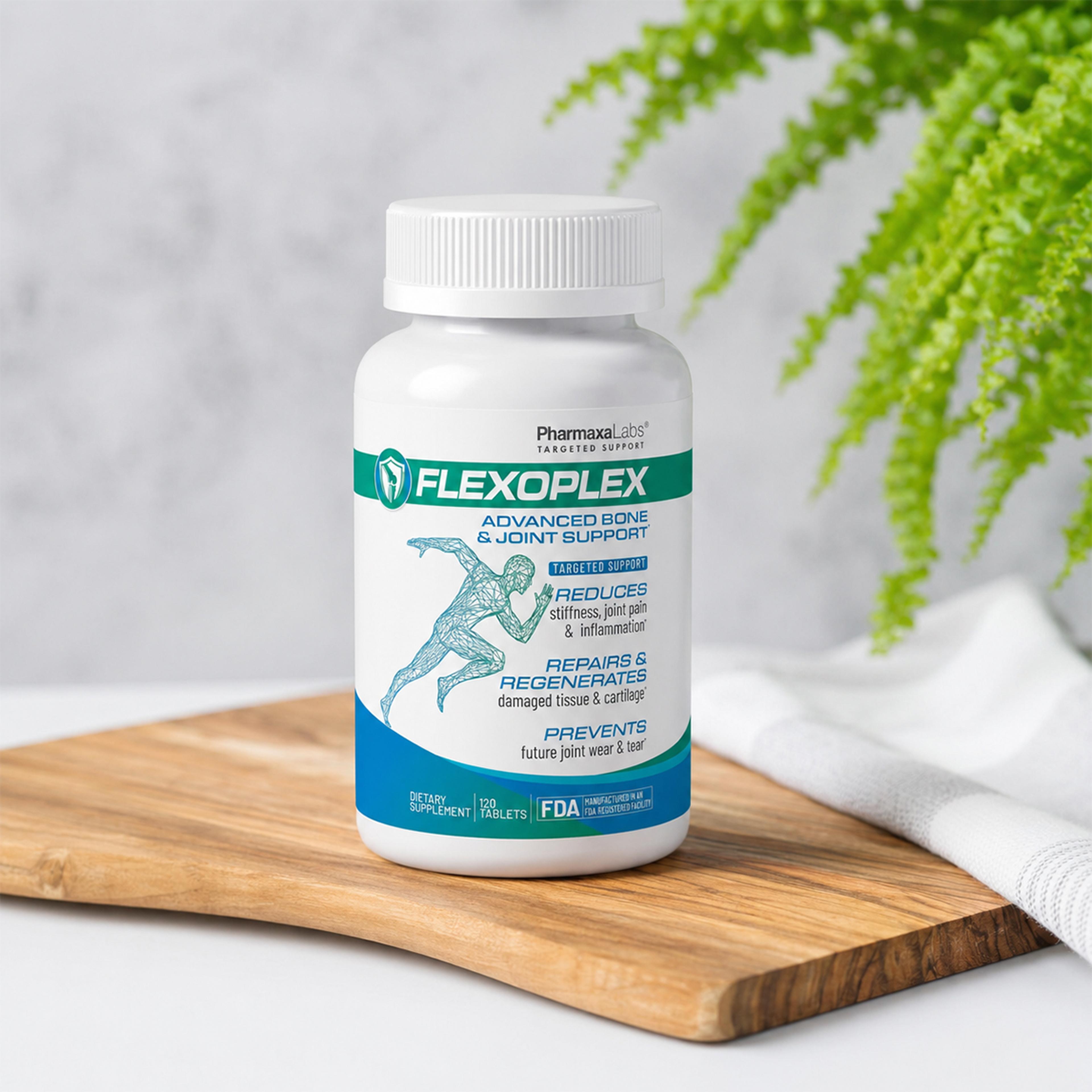 A white bottle of FLEXOPLEX Advanced Bone & Joint Support dietary supplement on a wooden board with a green fern in the background.