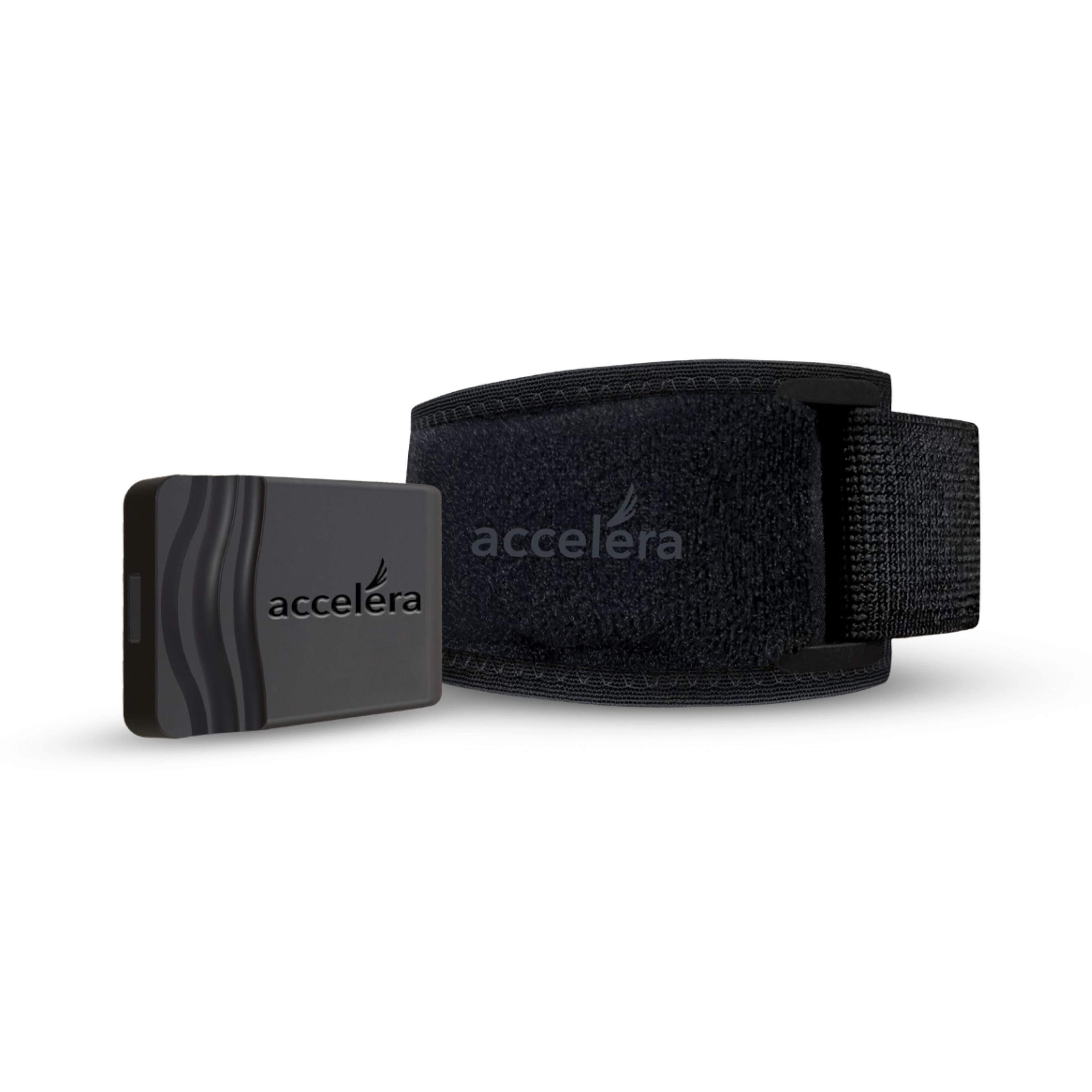 A black rectangular Accelera device next to a black Accelera fabric strap.