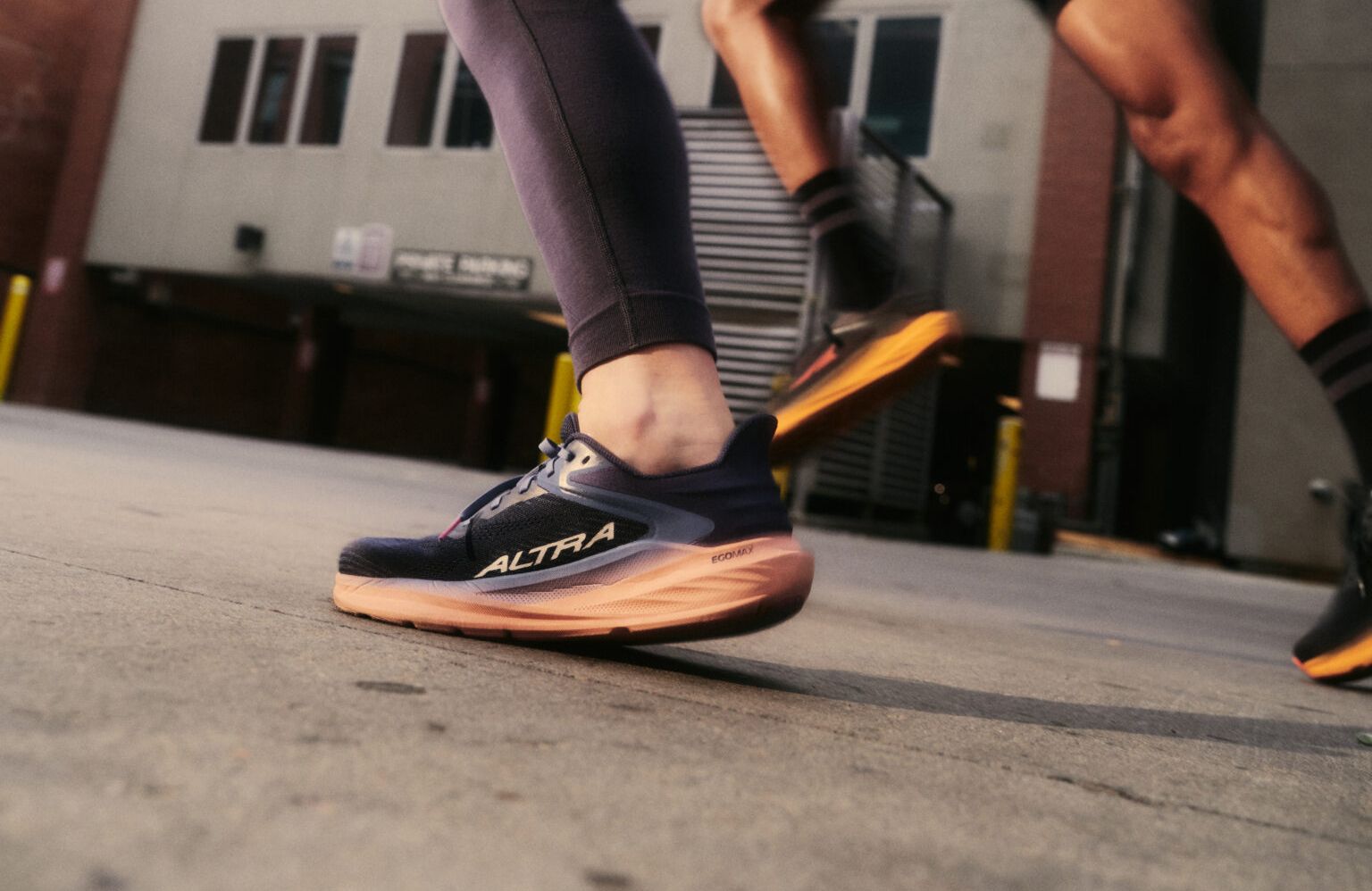 Closeup of woman and man wearing Altra Running shoes
