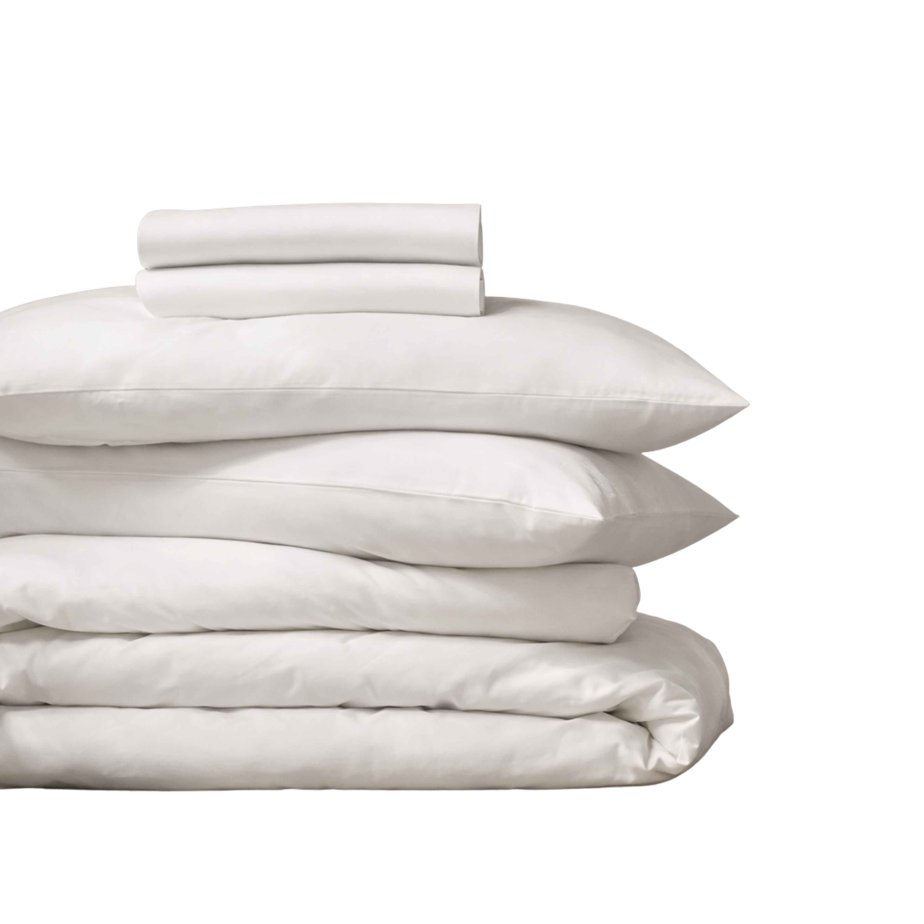 Stack of white sheets, pillows, and duvets.