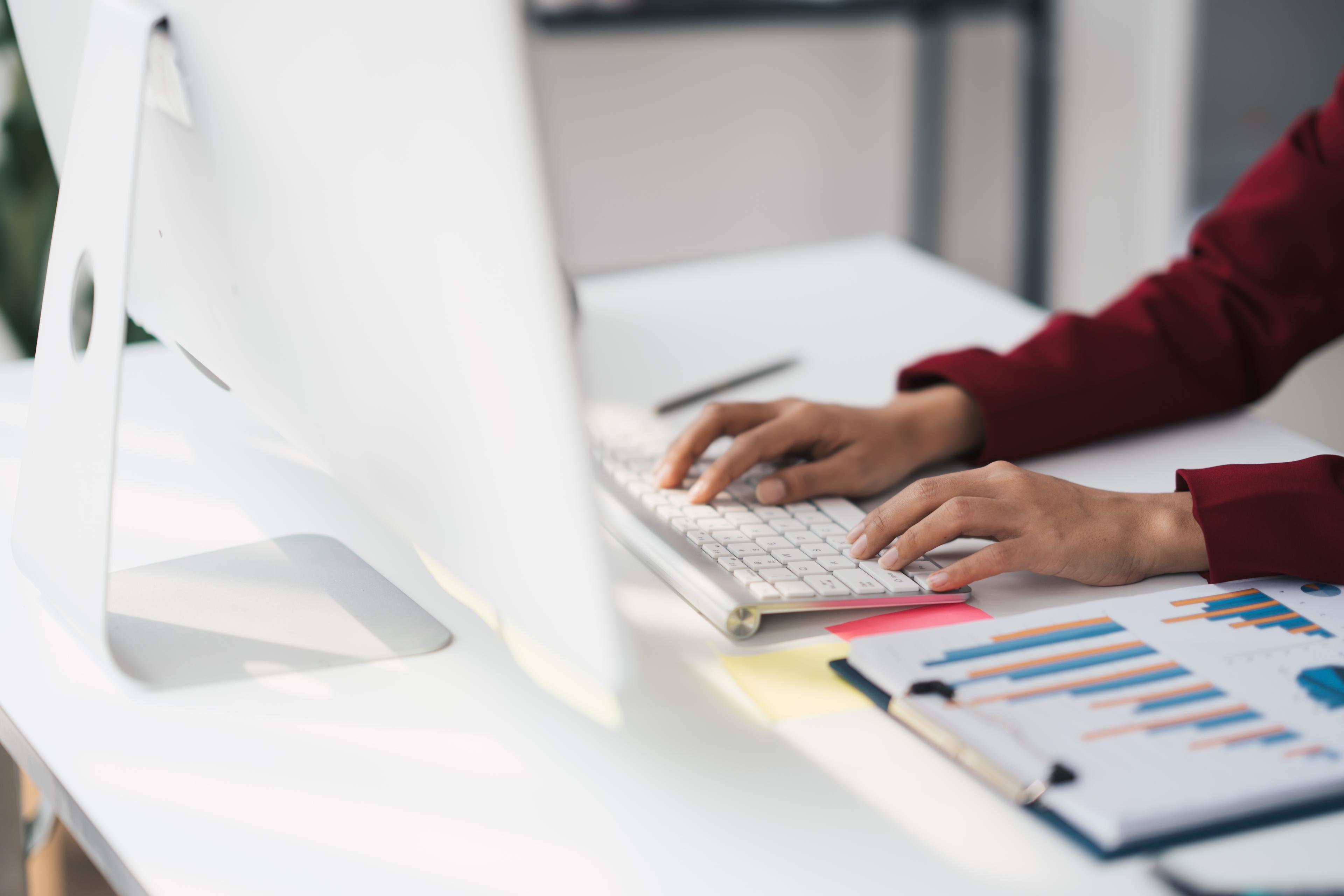 Person typing on computer