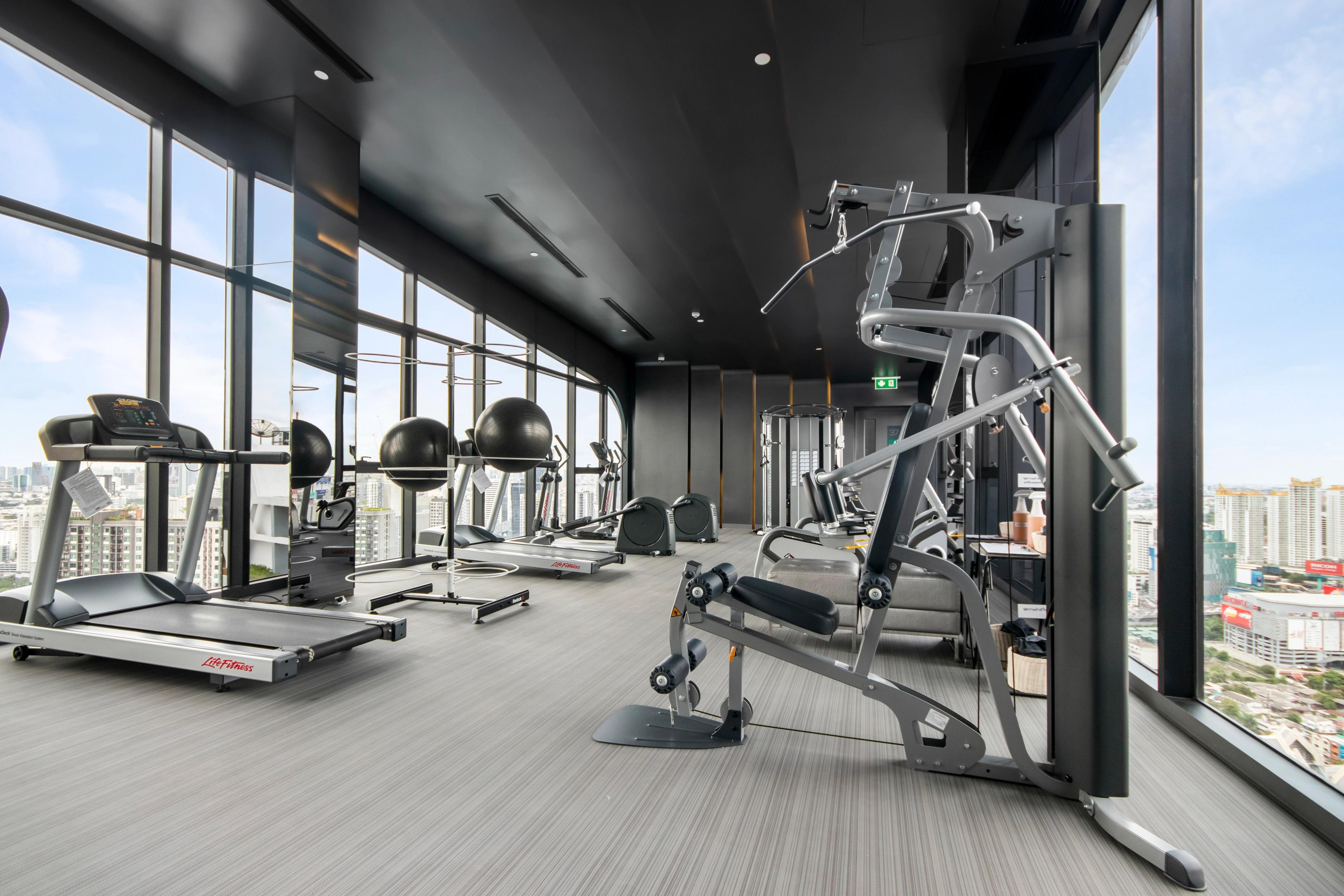 Gym featuring treadmills and weight lifting equipment