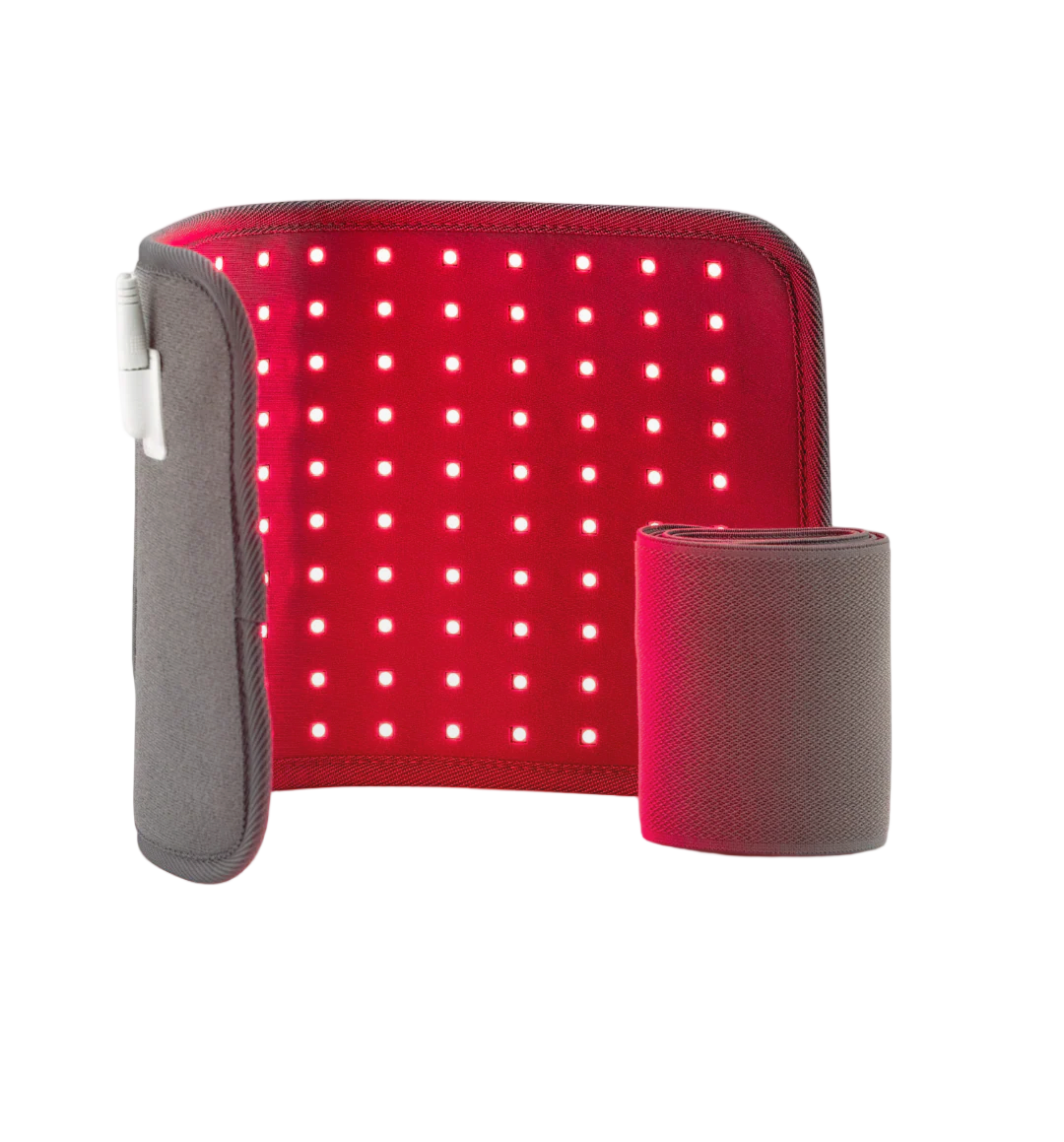 Red light therapy pad glowing with red light