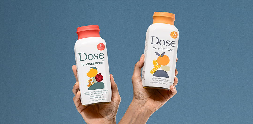 Dose products being held up on blue background