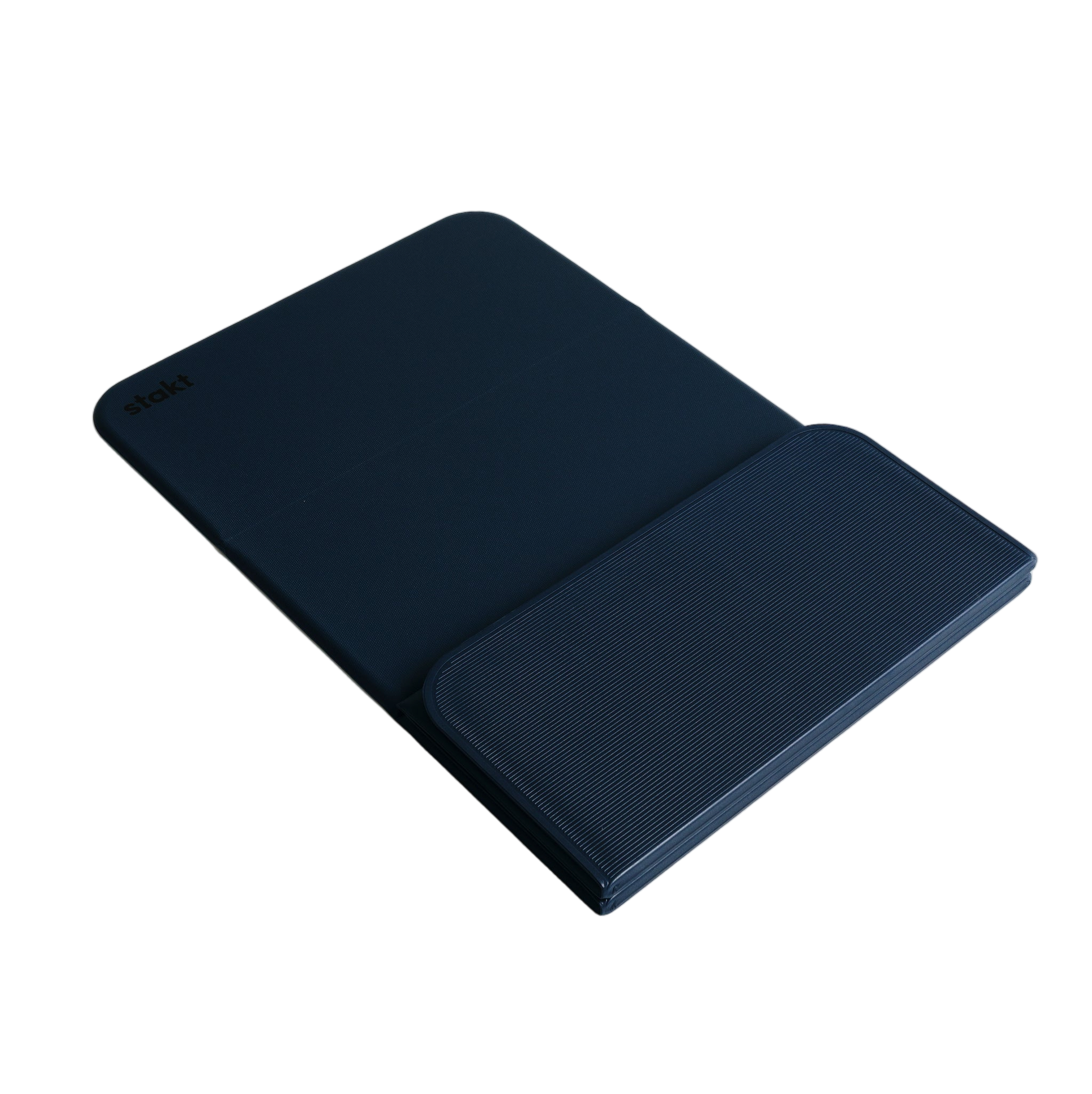 Folded Stakt Mat Pro standing upright on floor