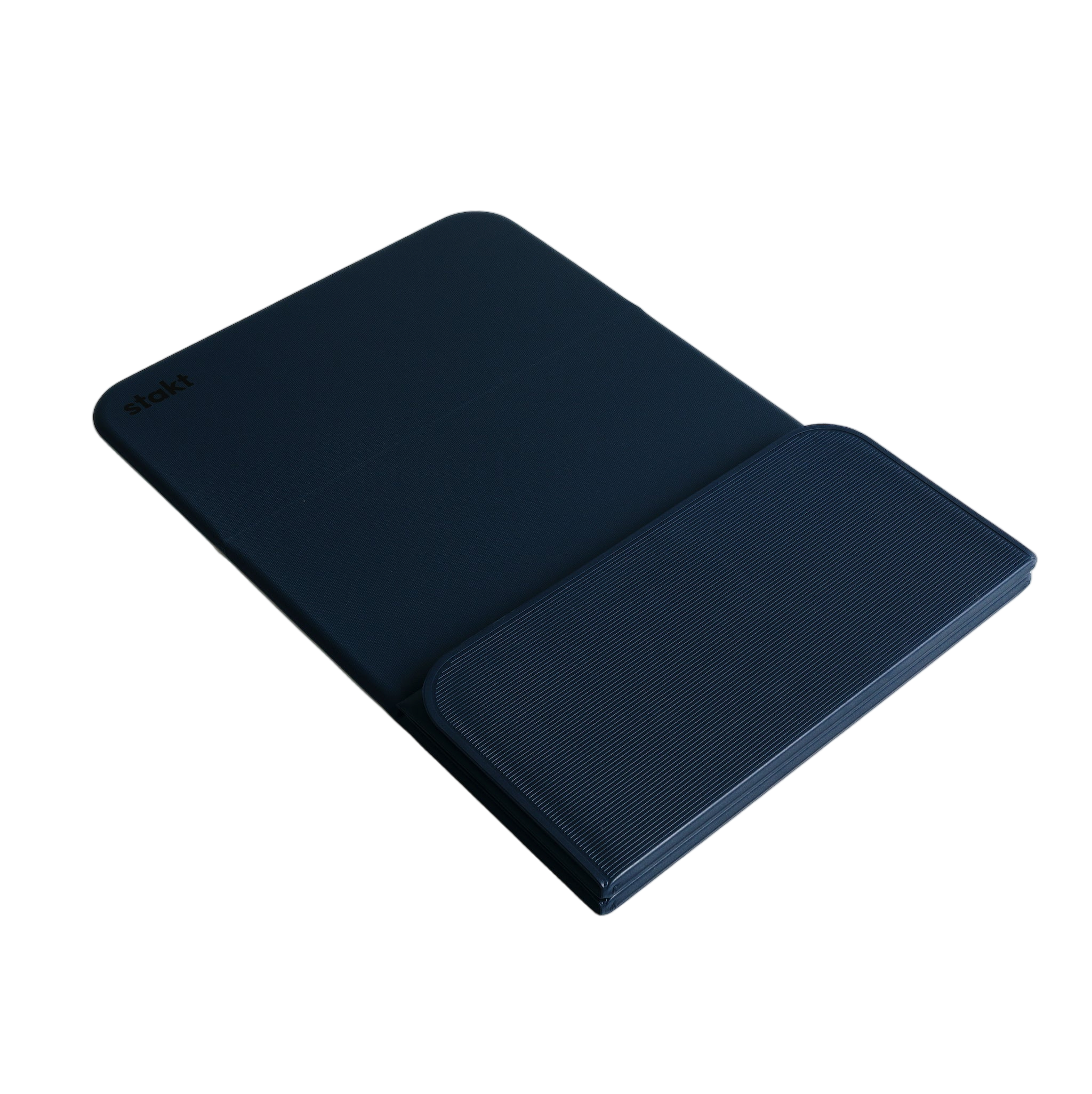 Folded Stakt Mat Pro standing upright on floor