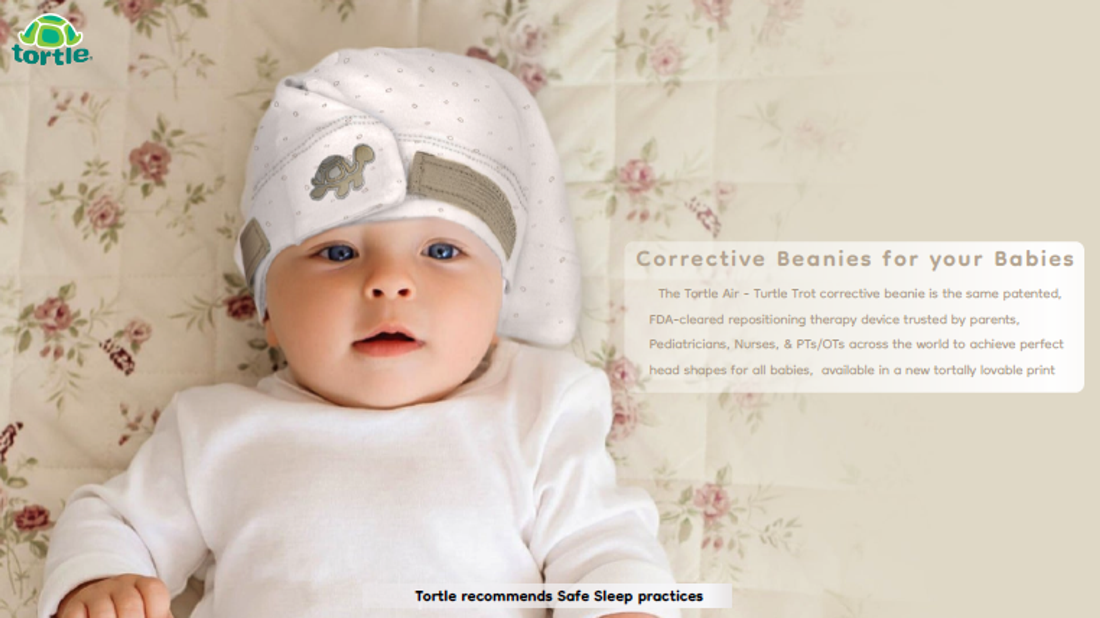 Baby wearing a white Tortie corrective beanie with a turtle emblem, lying on a floral blanket.