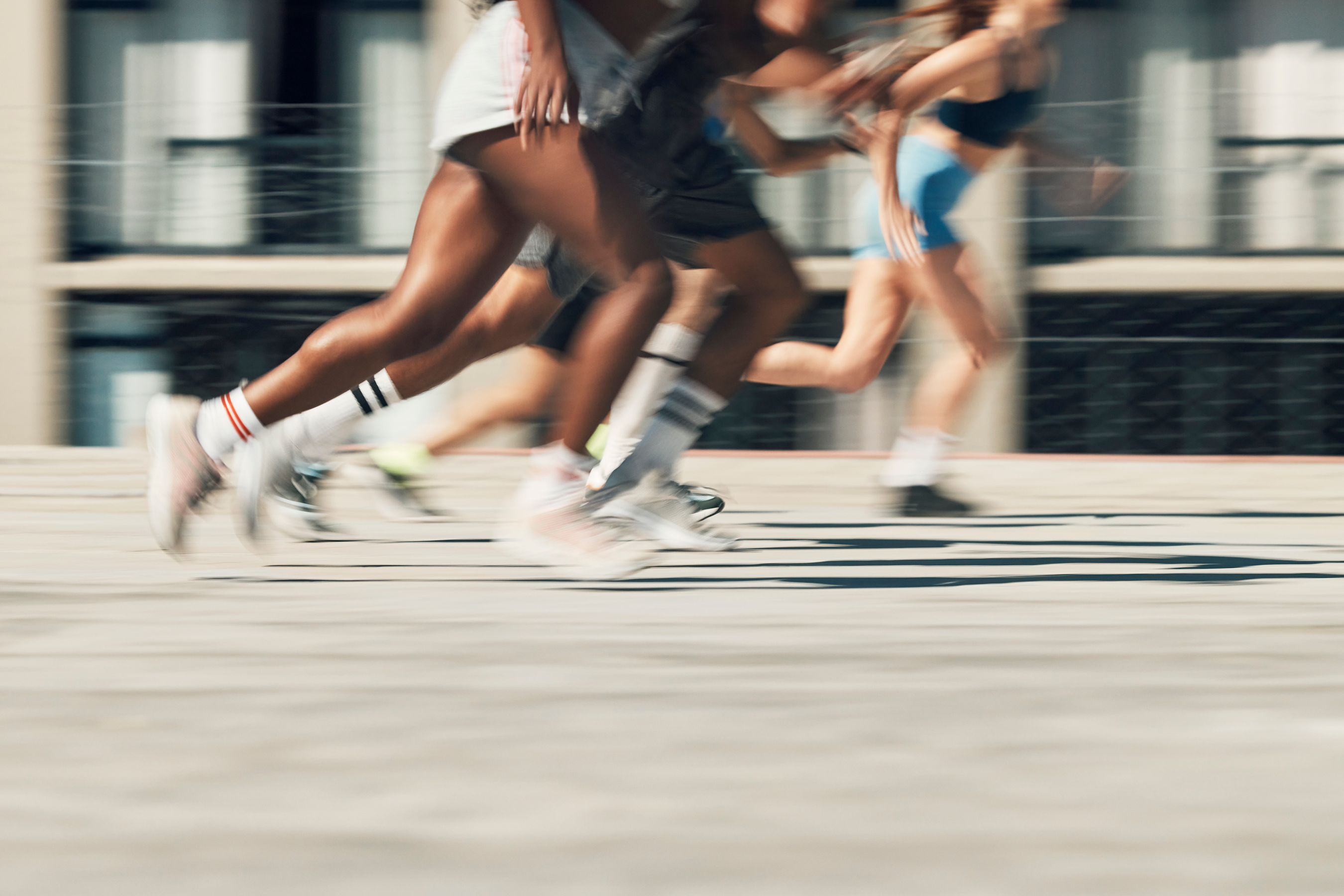 Running motion and four people running on a path