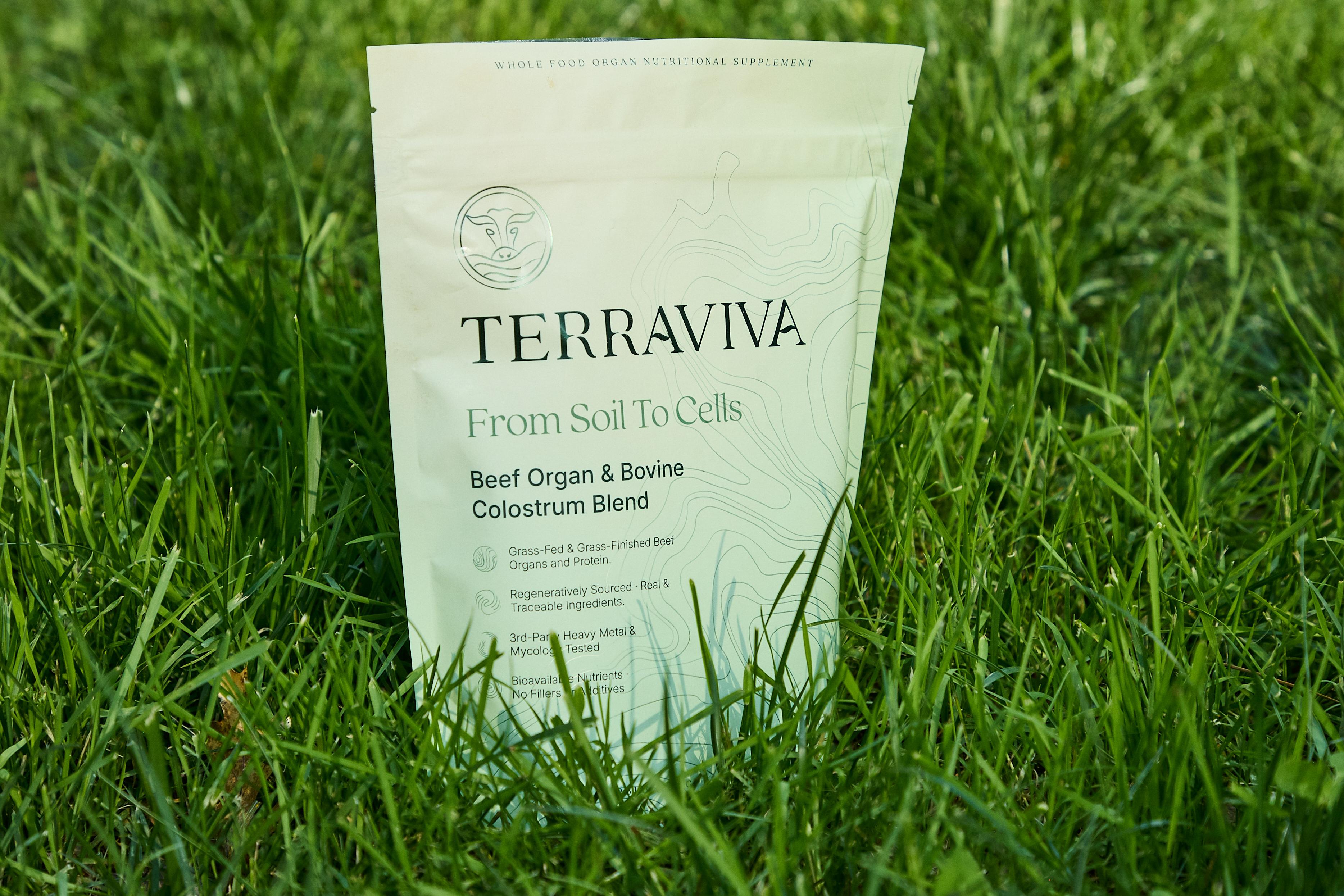 TERRAVIVA Beef Organ & Bovine Colostrum Blend pouch standing in green grass.