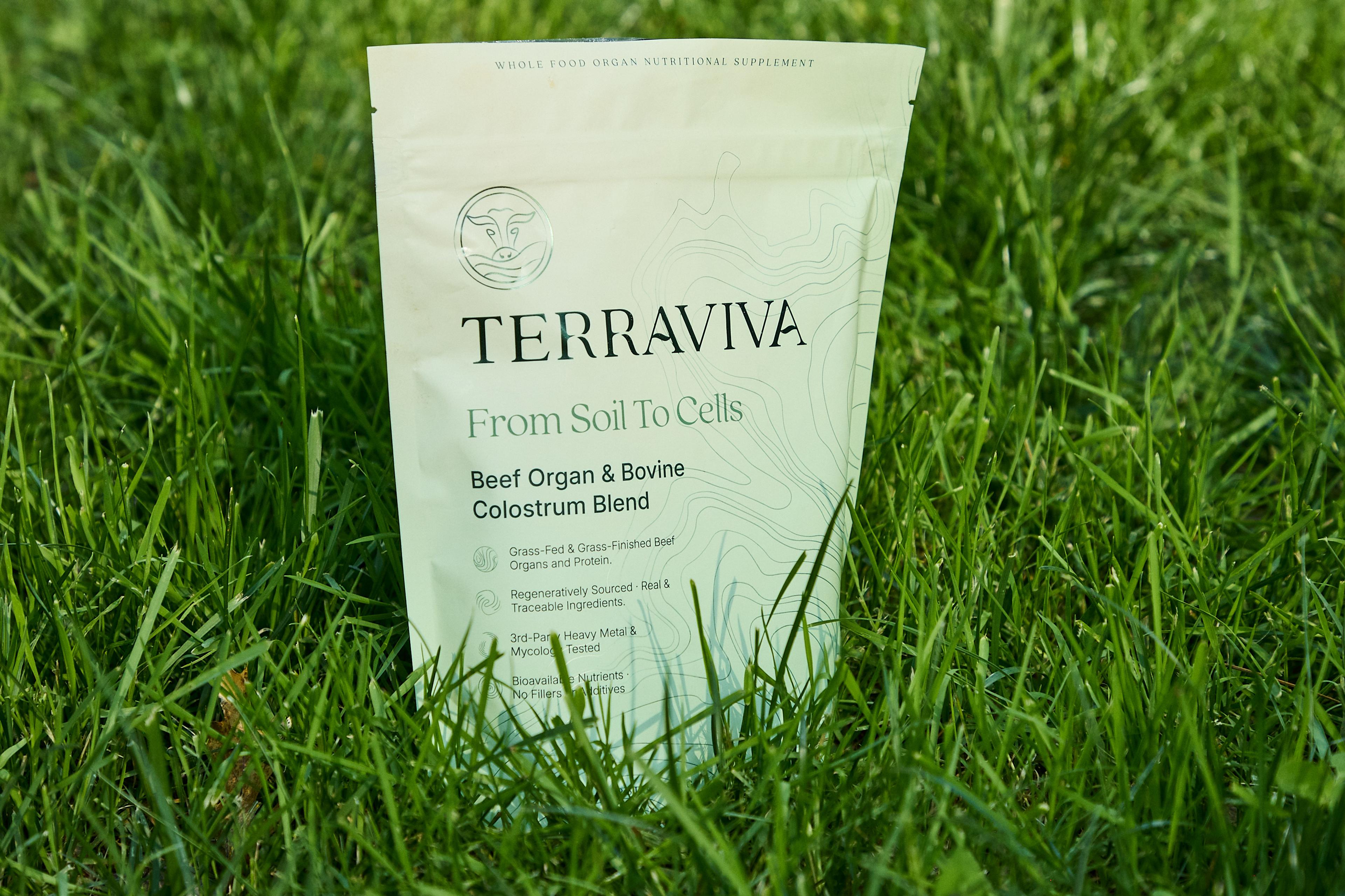 TERRAVIVA Beef Organ & Bovine Colostrum Blend pouch standing in green grass.