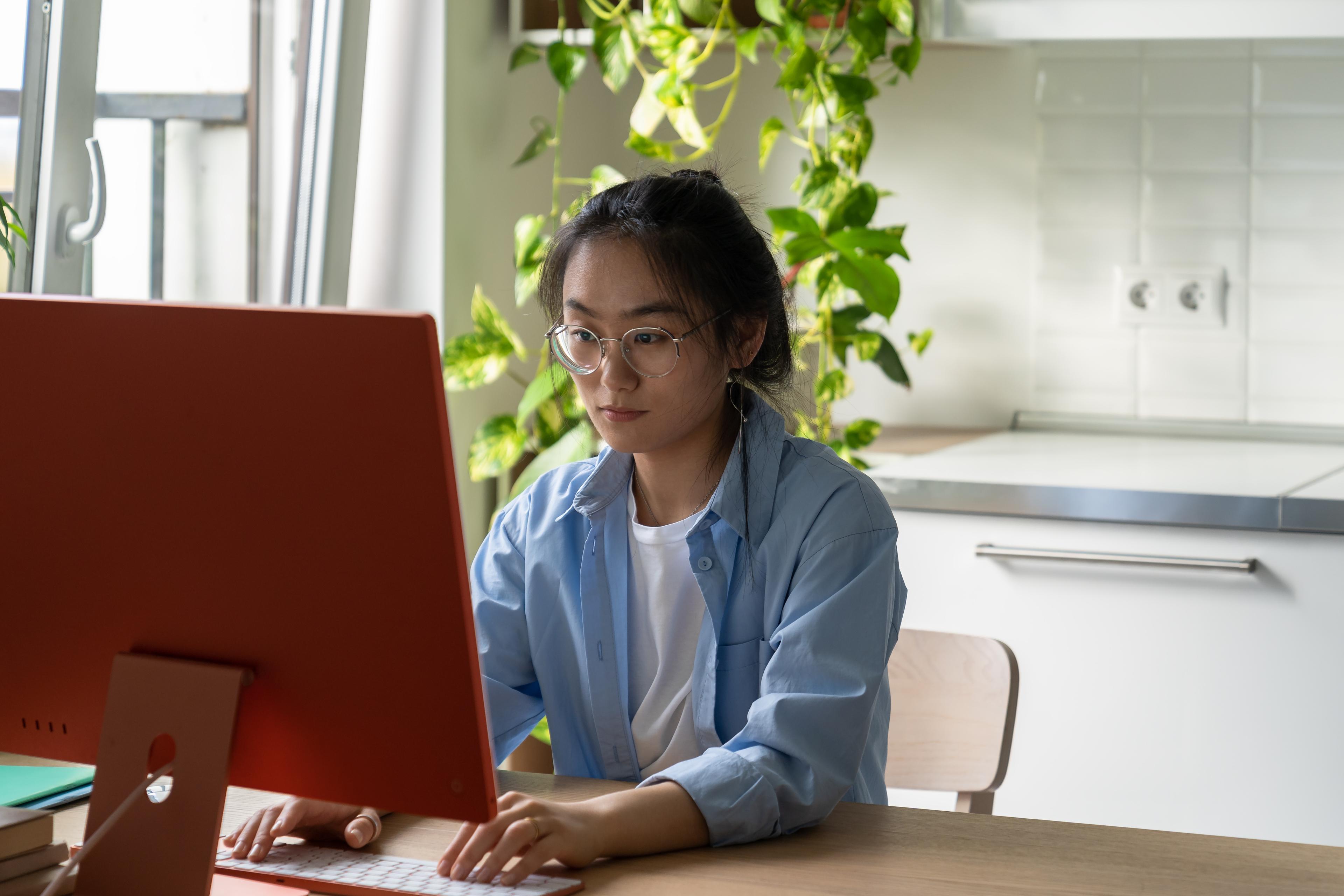 Woman focusing while working on the computer